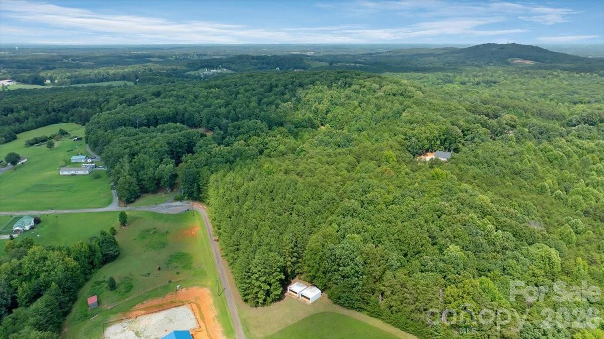 Elevated view of the wooded setting and surrounding rural landscape. - 01 Fishermans Lane, Maiden