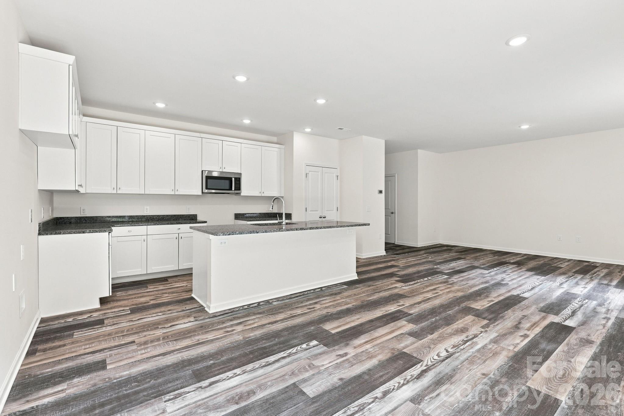 Breakfast area to Kitchen and living - 837 Old Mountain Road, Statesville