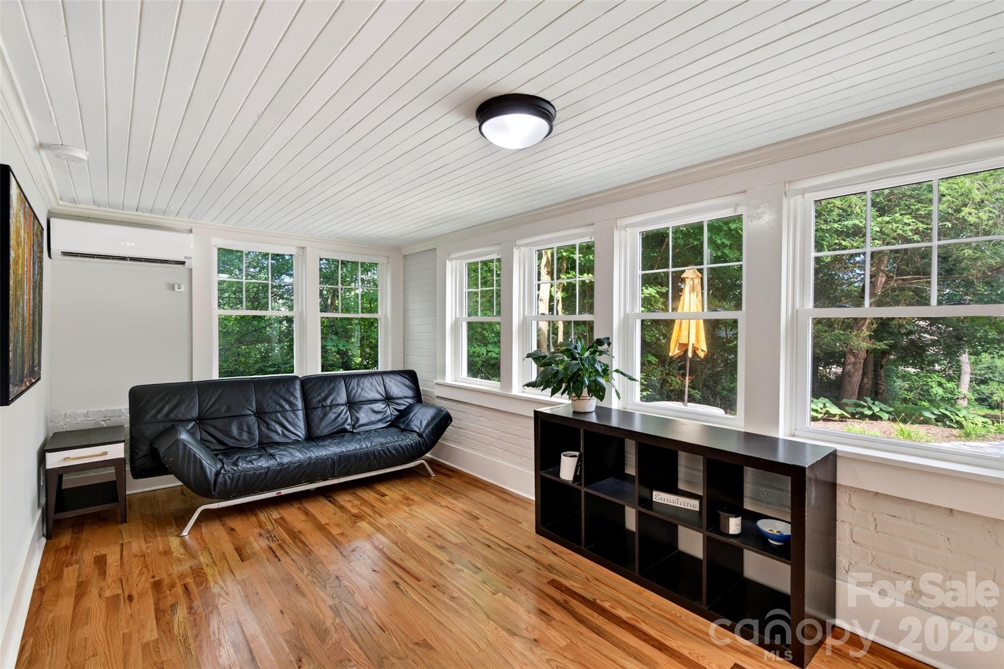 Lower level living room facing terraced back yard - 55 Edgemont Road, Asheville