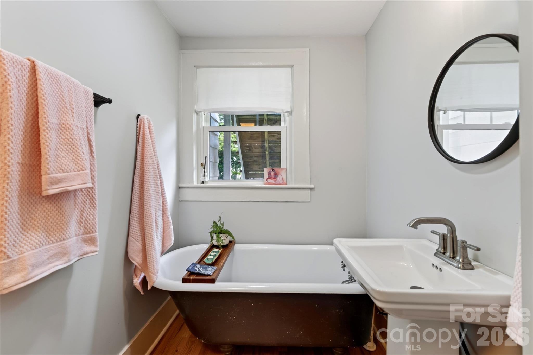 Lower level bathroom with clawfoot tub - 55 Edgemont Road, Asheville