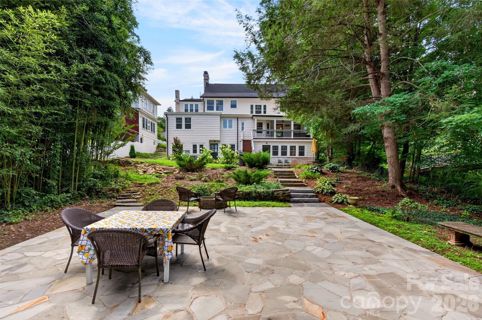 View of back of the house from lower level of terraced yard - 55 Edgemont Road, Asheville