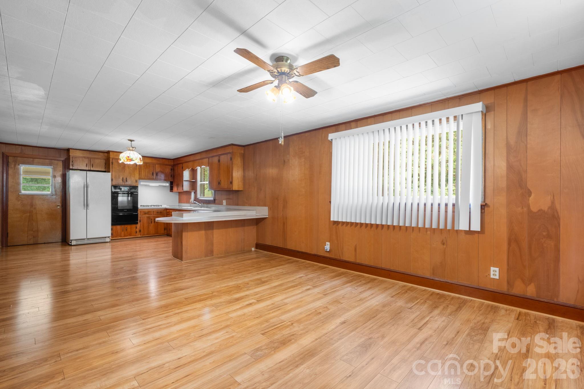 Kitchen & Additional Living Area With Wood Floors & Paneling That Can Be Painted - 4370 Dynasty Lane, Hudson