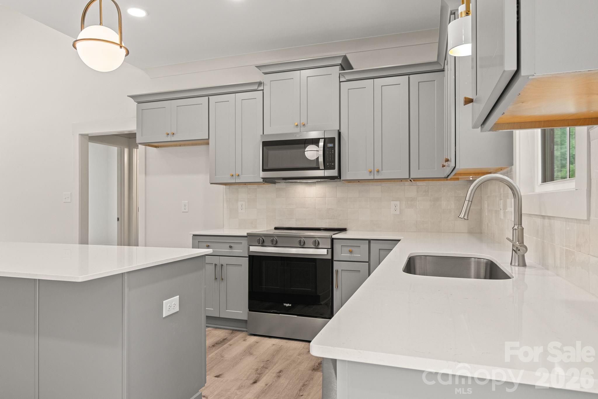 Kitchen - quartz counters & tiled backsplash - 151 McCorkle Street, York