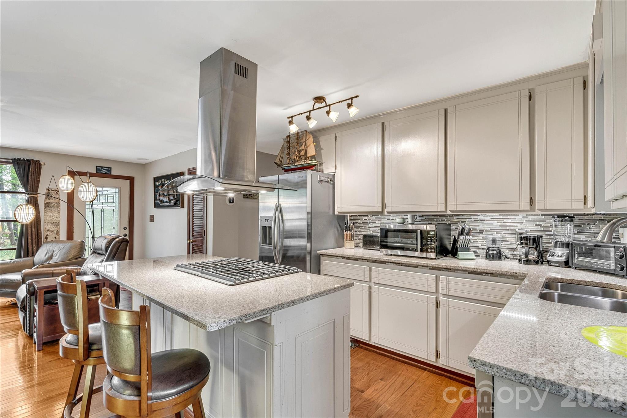 Kitchen with refrigerator that remains. 7697 Katherine Drive - 7697 Katherine Drive, Denver