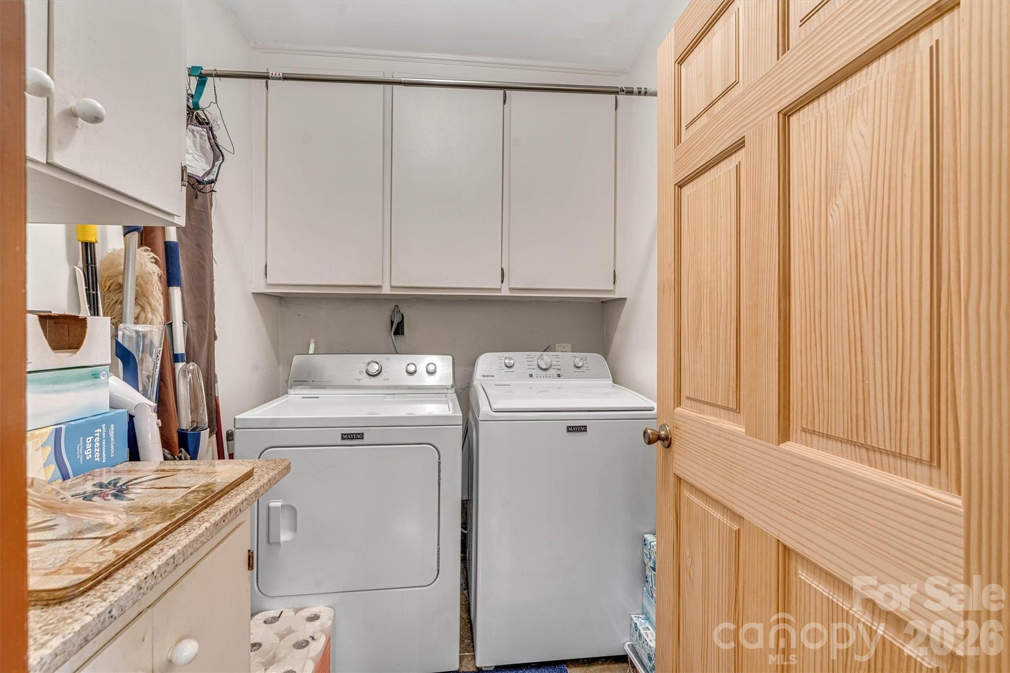 Laundry room with washer & dryer that will remain in the home. 7697 Katherine Drive - 7697 Katherine Drive, Denver