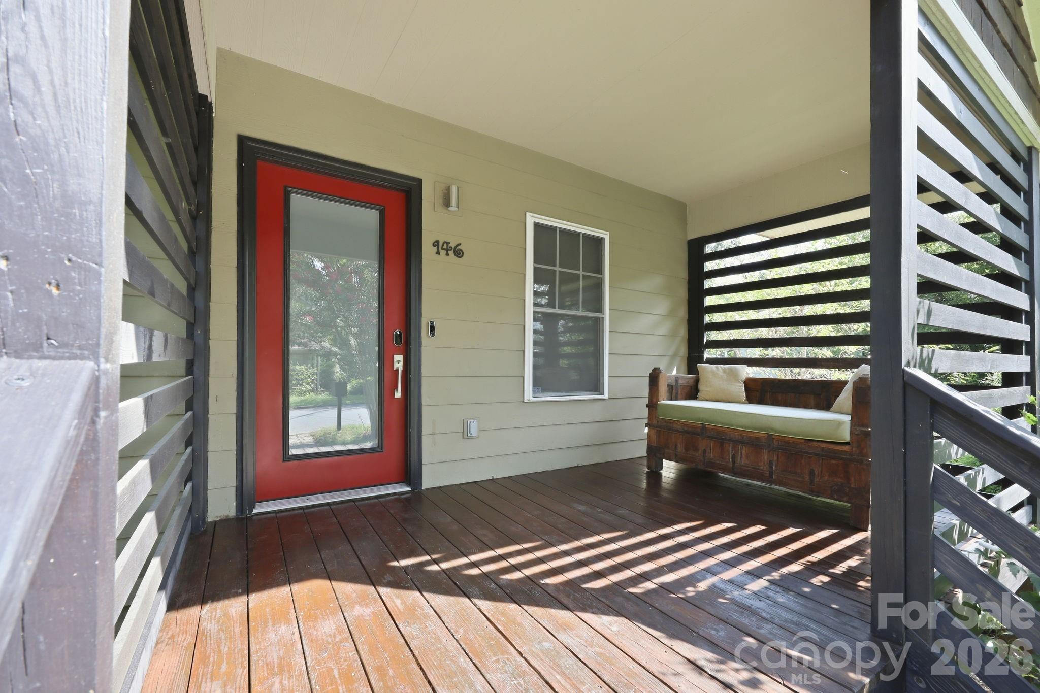 Covered front porch featuring a privacy screen. - 146 Courtland Avenue, Asheville