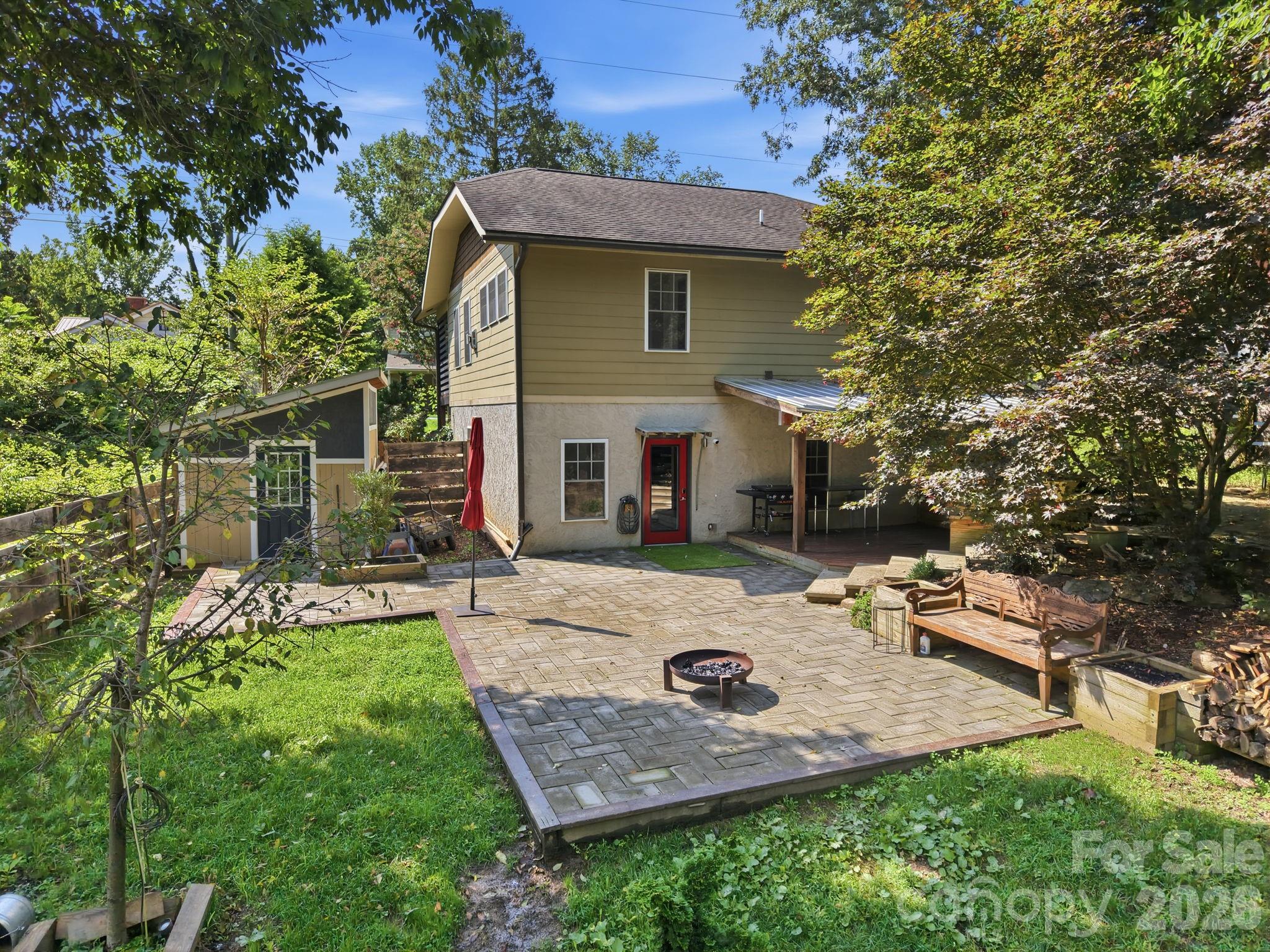 Paver patio designed for evening entertaining and outdoor gatherings. - 146 Courtland Avenue, Asheville