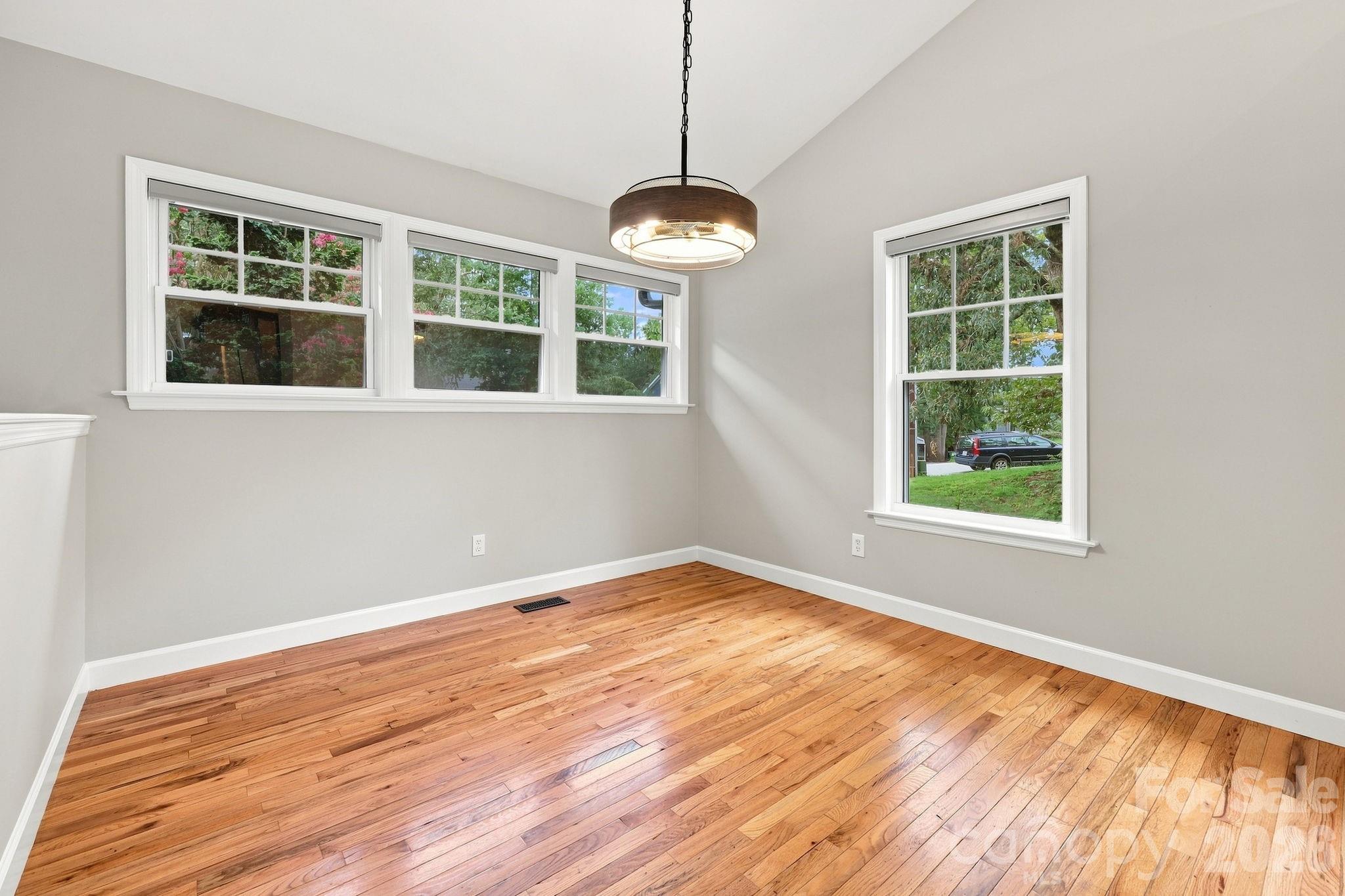 Welcoming dining room with plenty of natural light and space for entertaining. - 146 Courtland Avenue, Asheville
