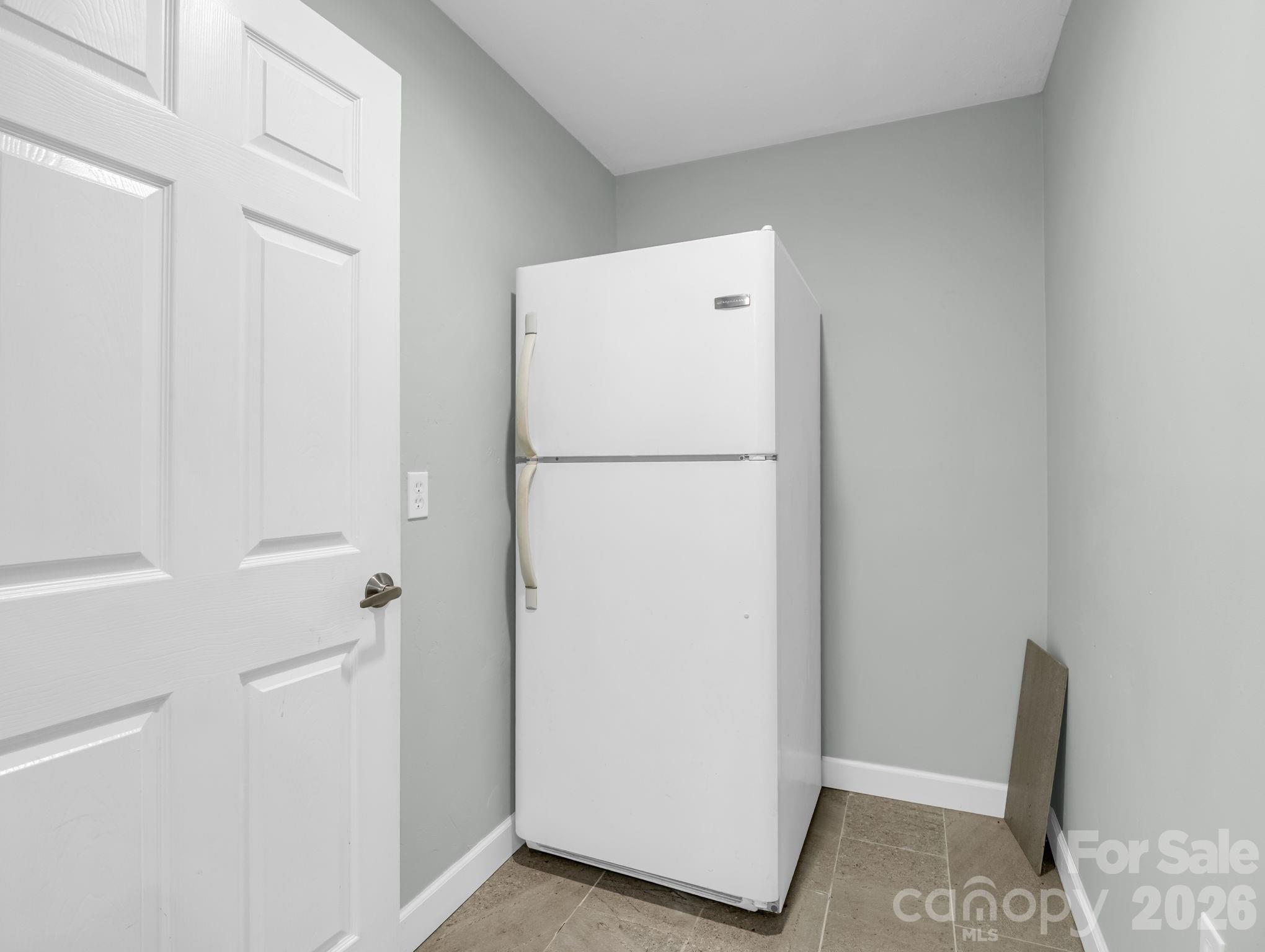 MAIN LEVEL: 2nd Fridge in Laundry Room - 10 Chestnut Ridge Road, Mills River