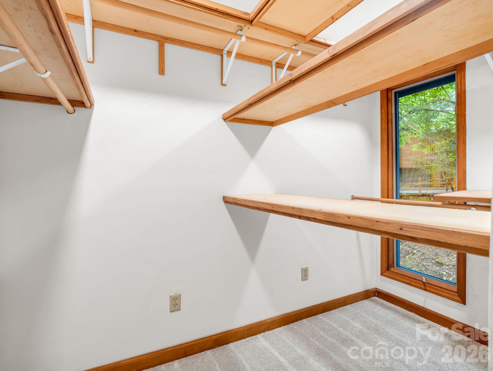 Primary giant Walk-in Closet w/ custom shelving - 10 Chestnut Ridge Road, Mills River