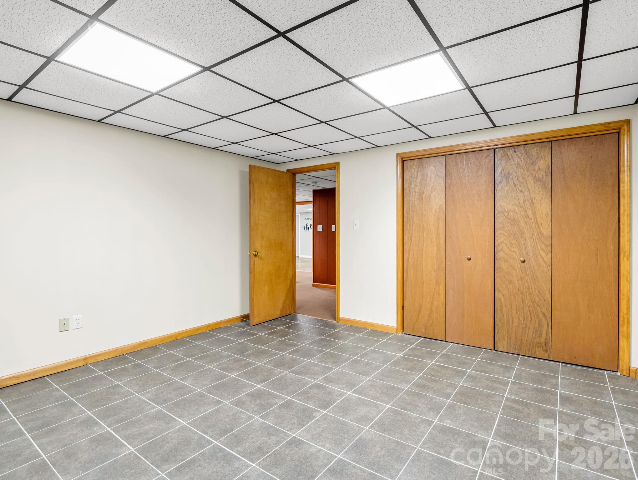 Lower level finished Flex Space / Storage Room with tile floor - 10 Chestnut Ridge Road, Mills River