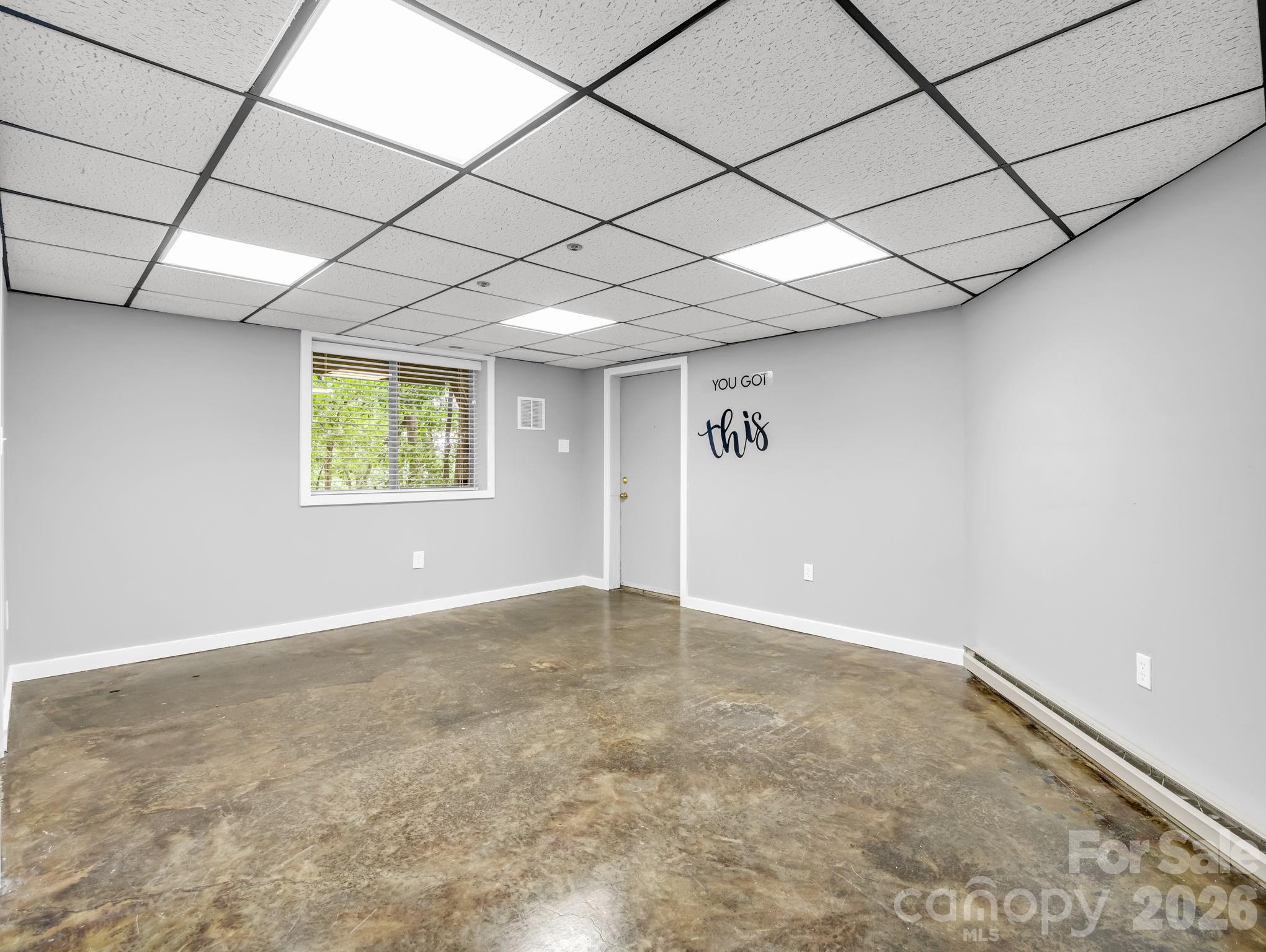 Lower level finished Bonus Room, with polished concrete floors - 10 Chestnut Ridge Road, Mills River