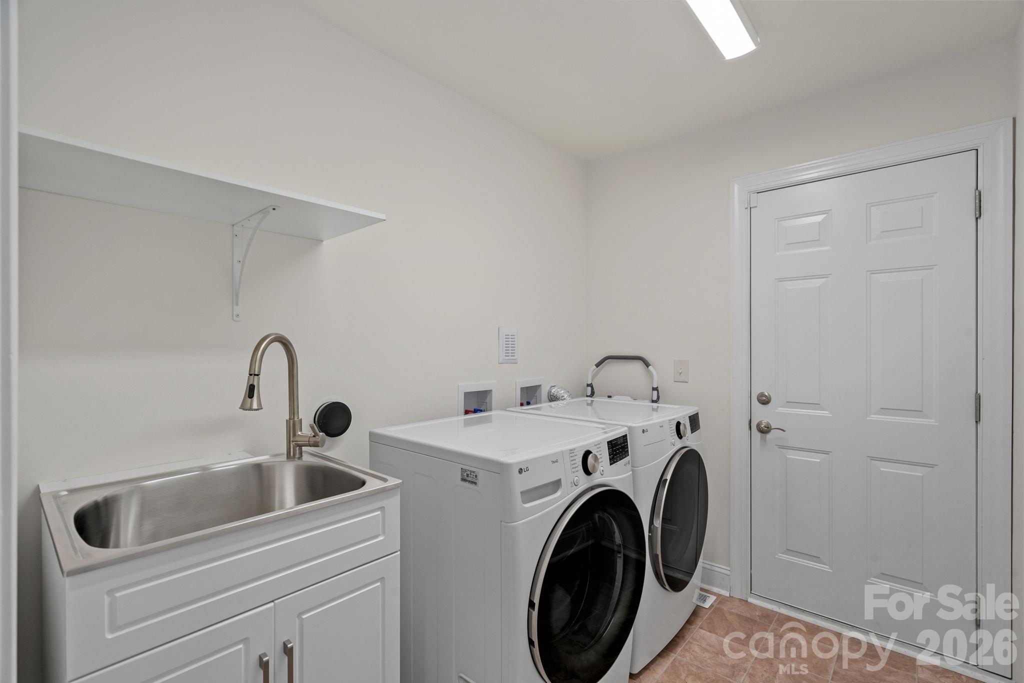 laundry room - new sink and cabinet - 9329 Uxbridge Lane, Huntersville