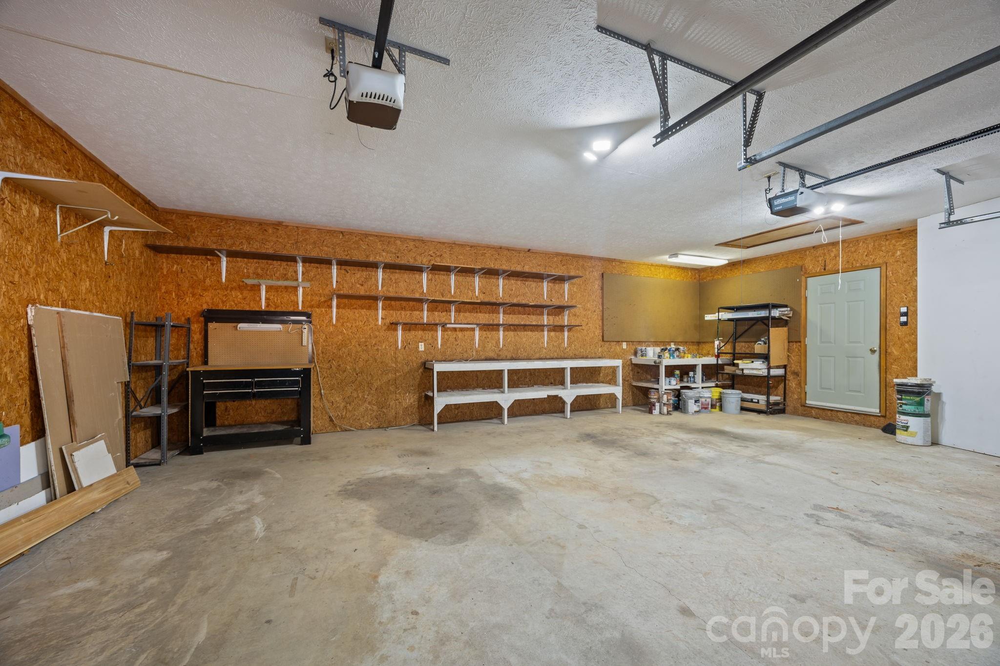 Spacious garage with plenty of storage - 1105 High Vista Drive, Mills River