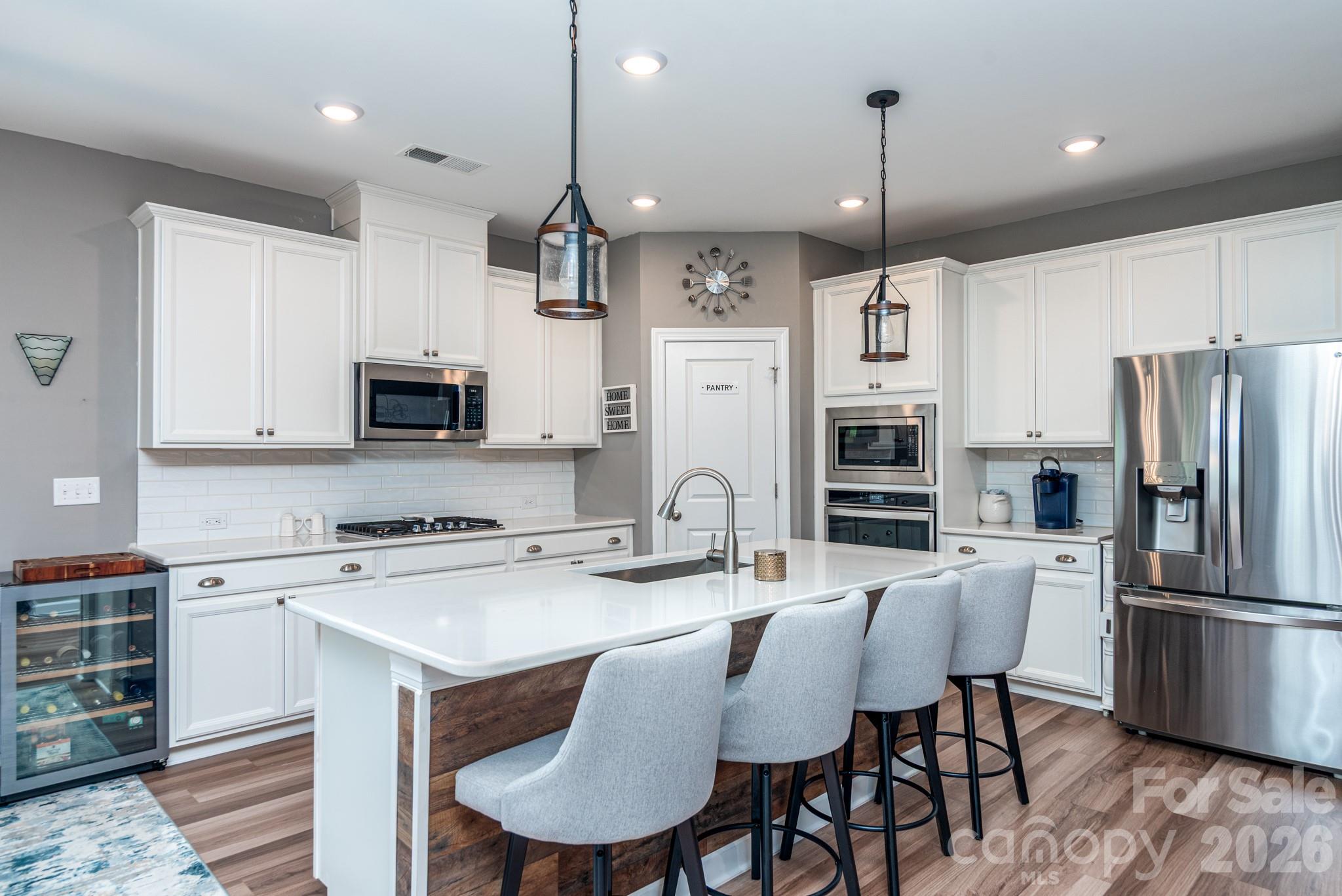 Island, cooktop, wall oven and microwave - 5134 Turtle Creek Drive, Denver