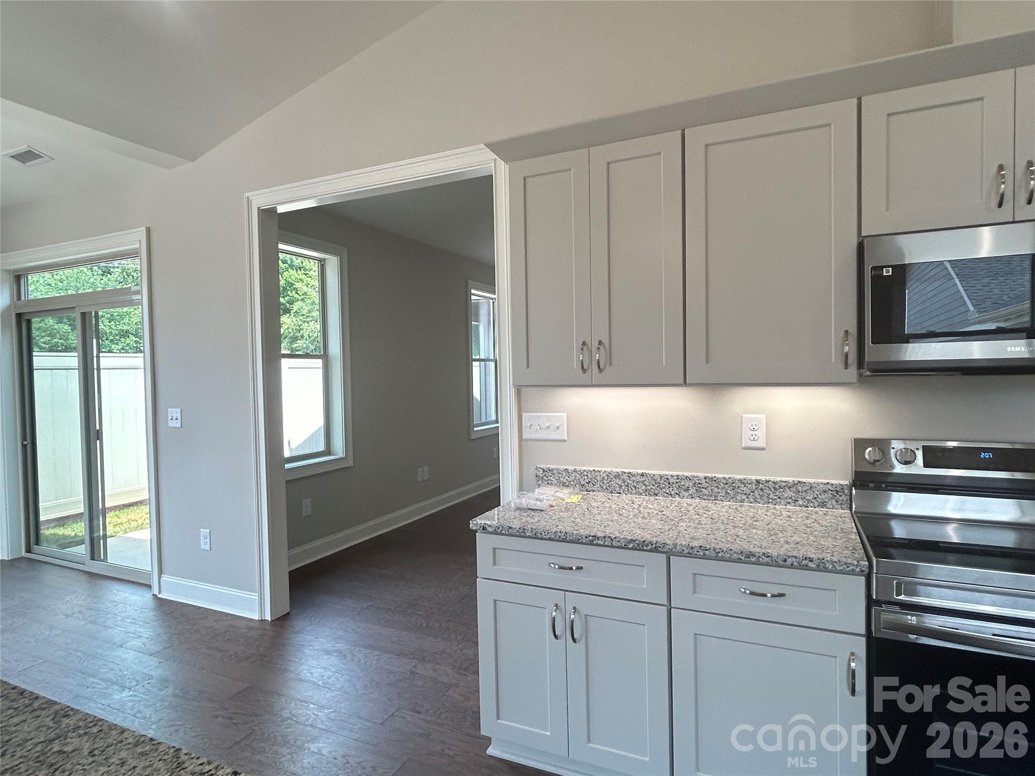 Kitchen to living space and sliding door to open patio. - 831-A Wynnshire Drive, Hickory