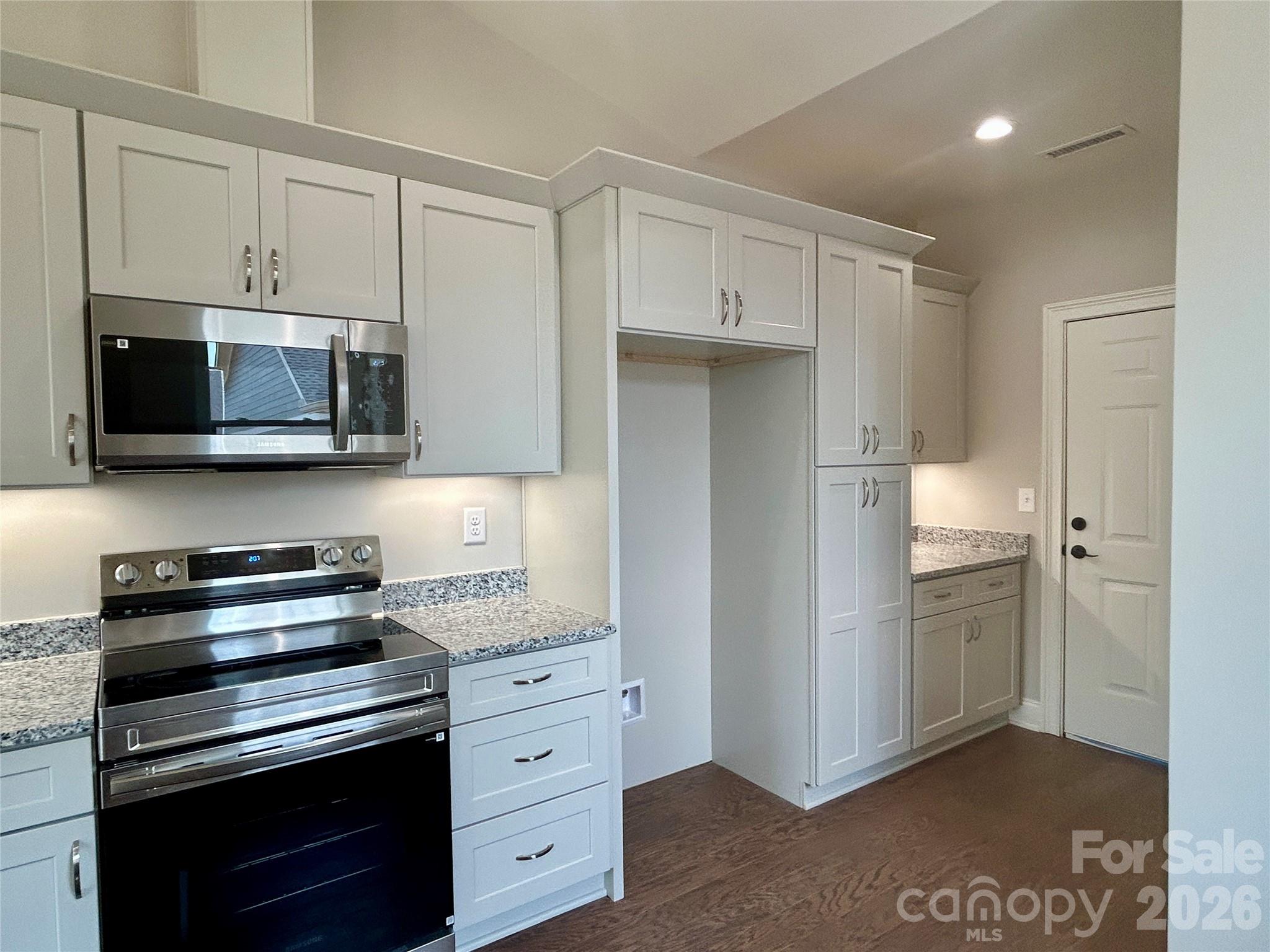 Space for refrigerator, door to garage. Granite counters. - 831-A Wynnshire Drive, Hickory