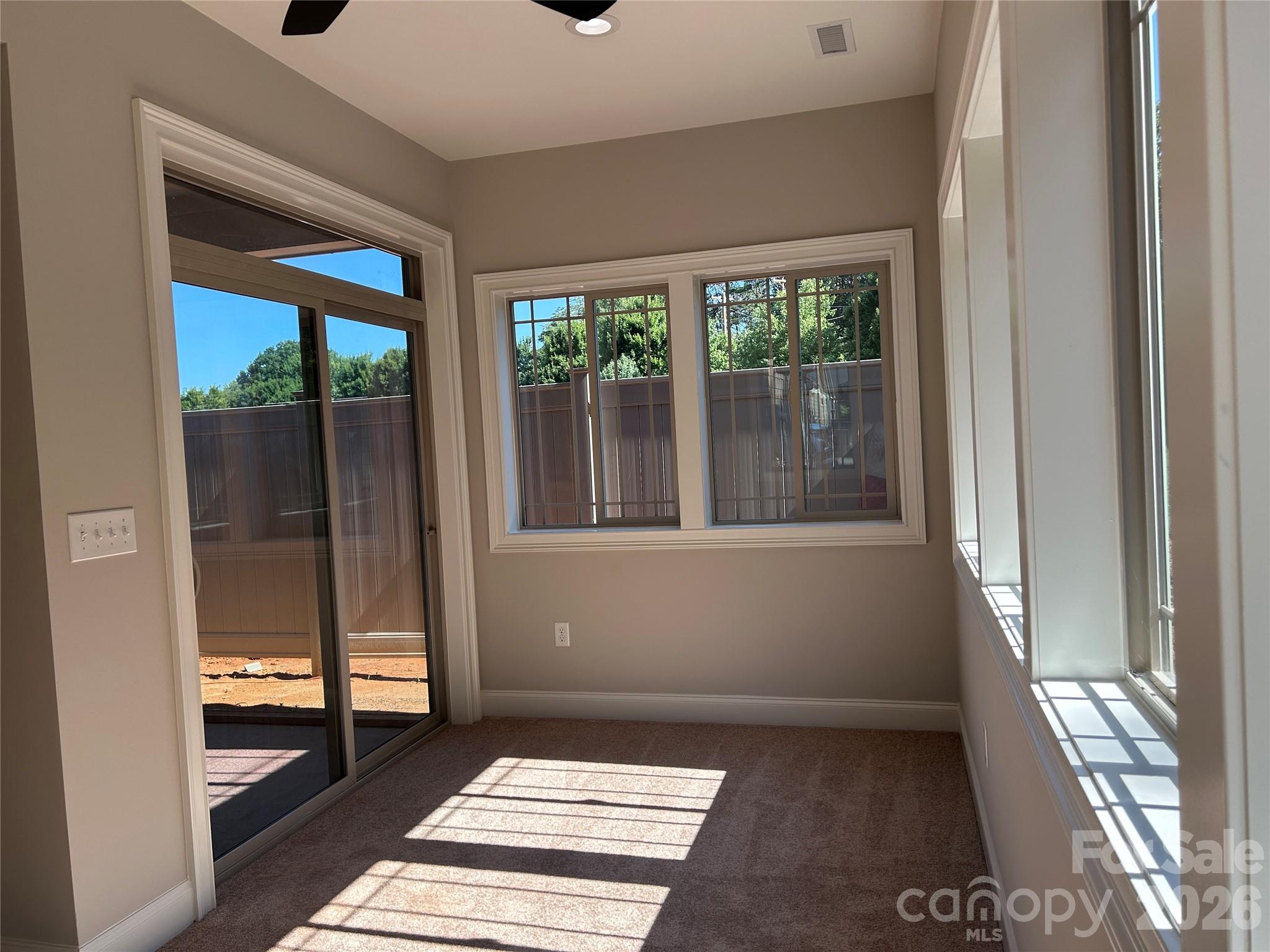 Sun room with sliding doors out to screened porch. - 831-A Wynnshire Drive, Hickory