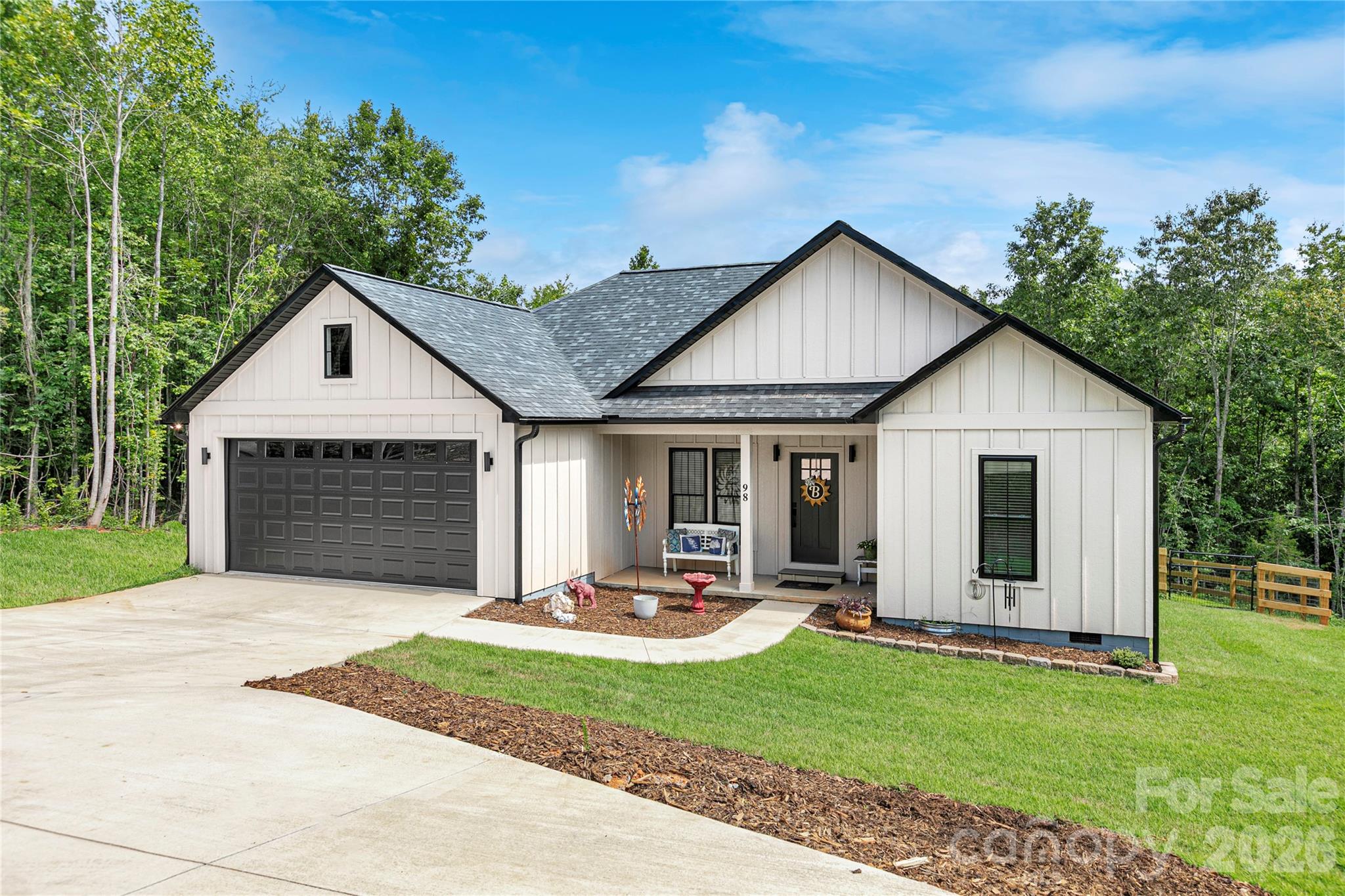 House from the front on the right-side in the convenient front vehicle parking area.! Notice the fence and gate to the back yard on the right side! - 98 Lexxi Lane, Tryon