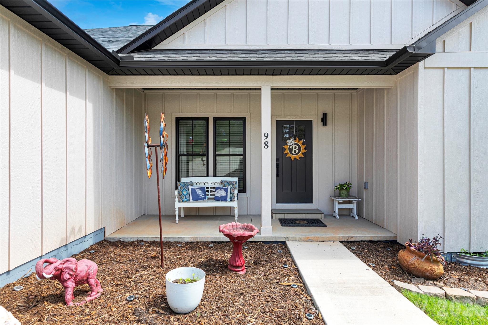 Front porch / patio and entry door with its mulched planter area in front! - 98 Lexxi Lane, Tryon