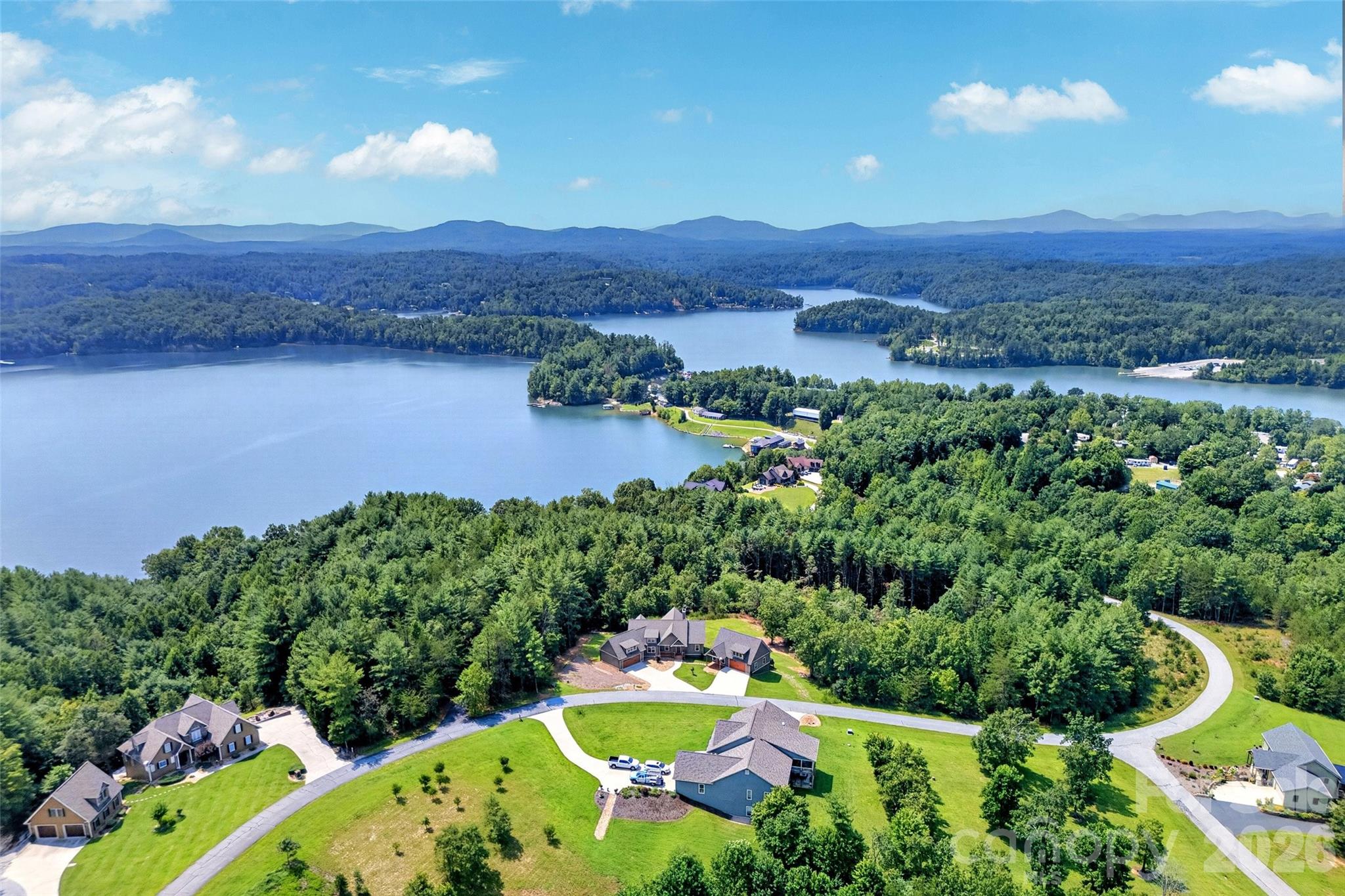 Aerial: the home sits above Lake James with community beach access minutes away - 207 Lake Crest Drive, Nebo