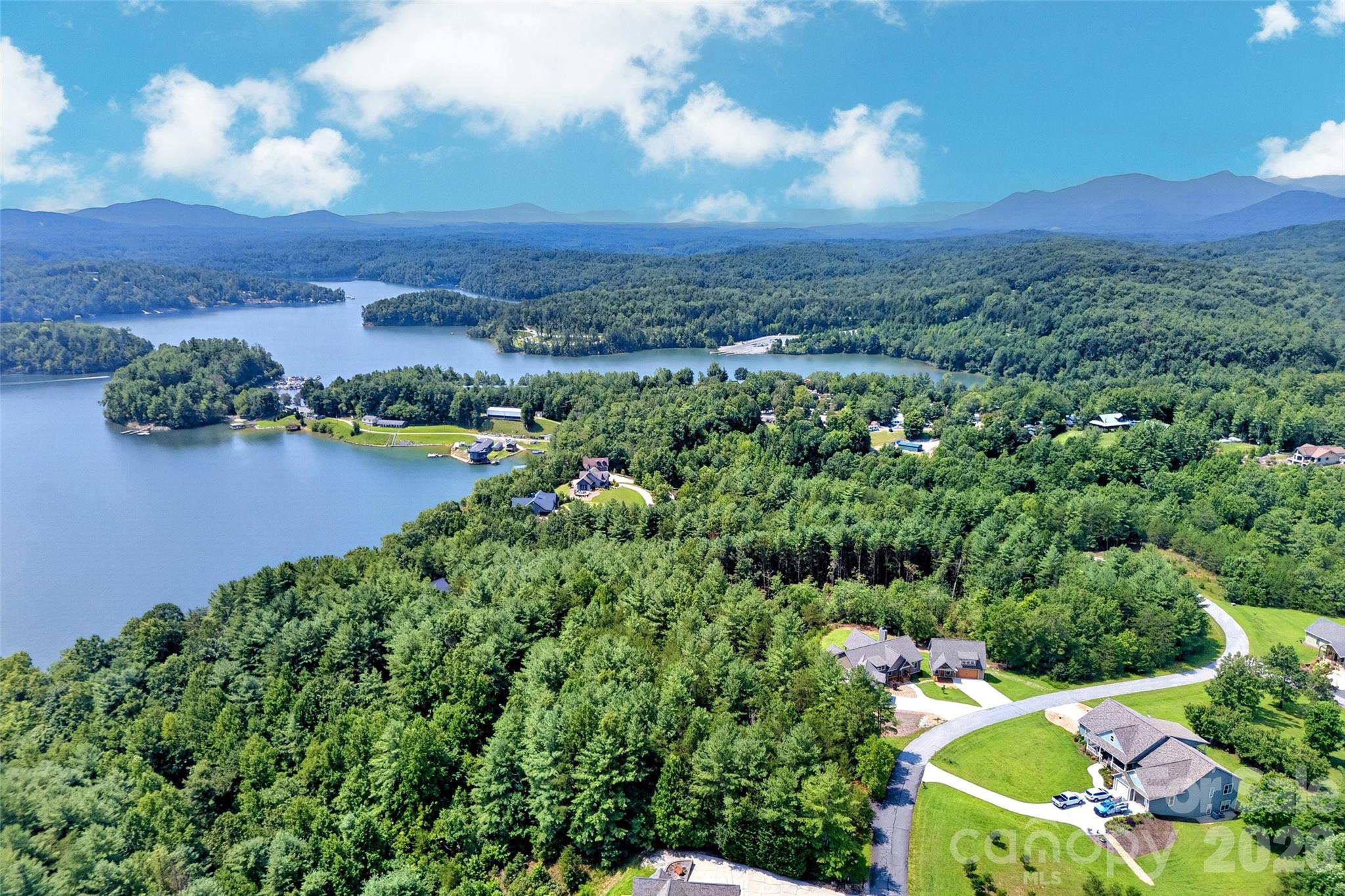 Aerial: the home sits above Lake James with community beach access minutes away - 207 Lake Crest Drive, Nebo