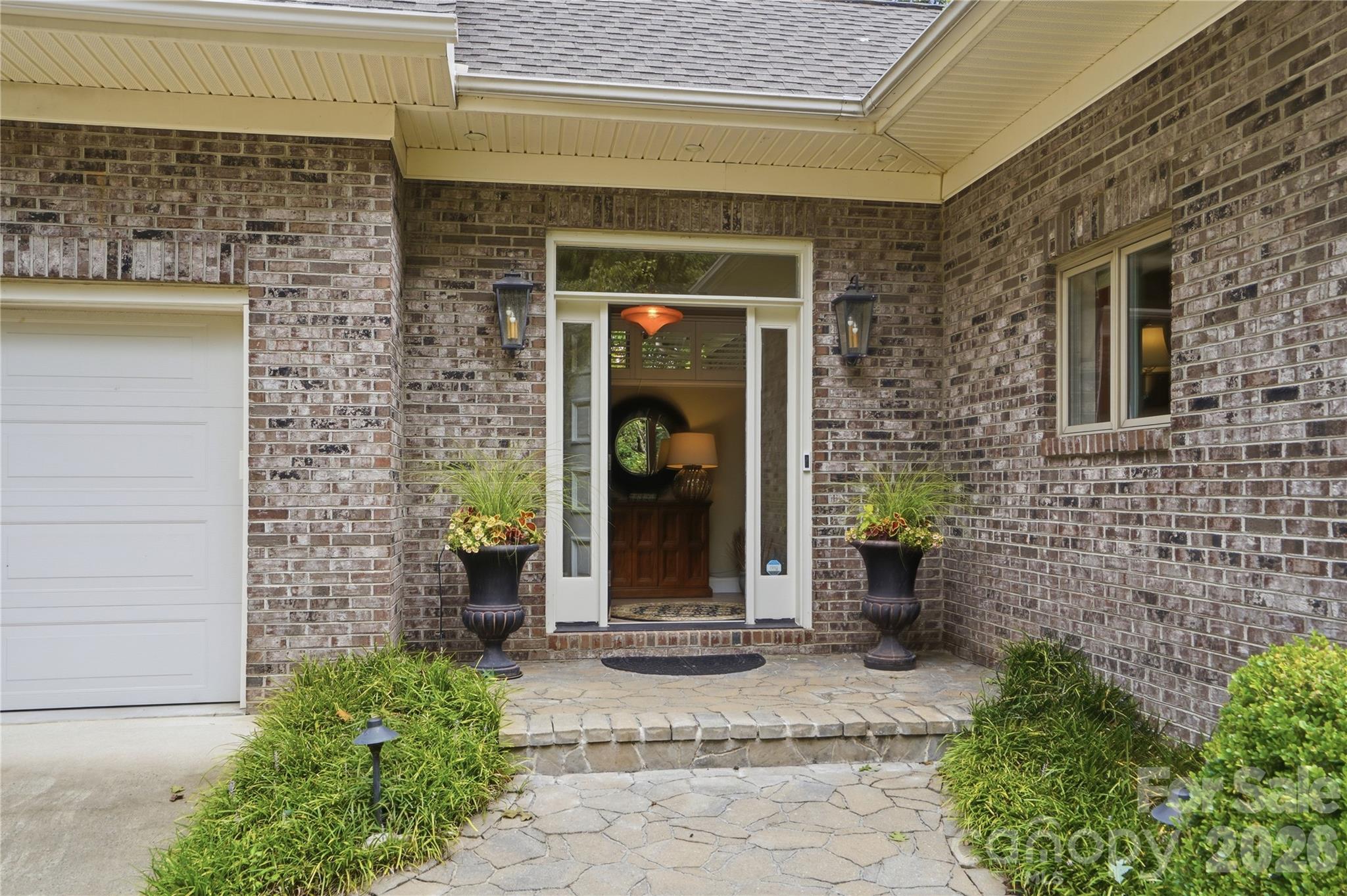 This all-brick home blends peaceful waterfront living with convenience to Charlotte and historic downtown Belmont - 1075 Lakefront Woods Drive, Belmont