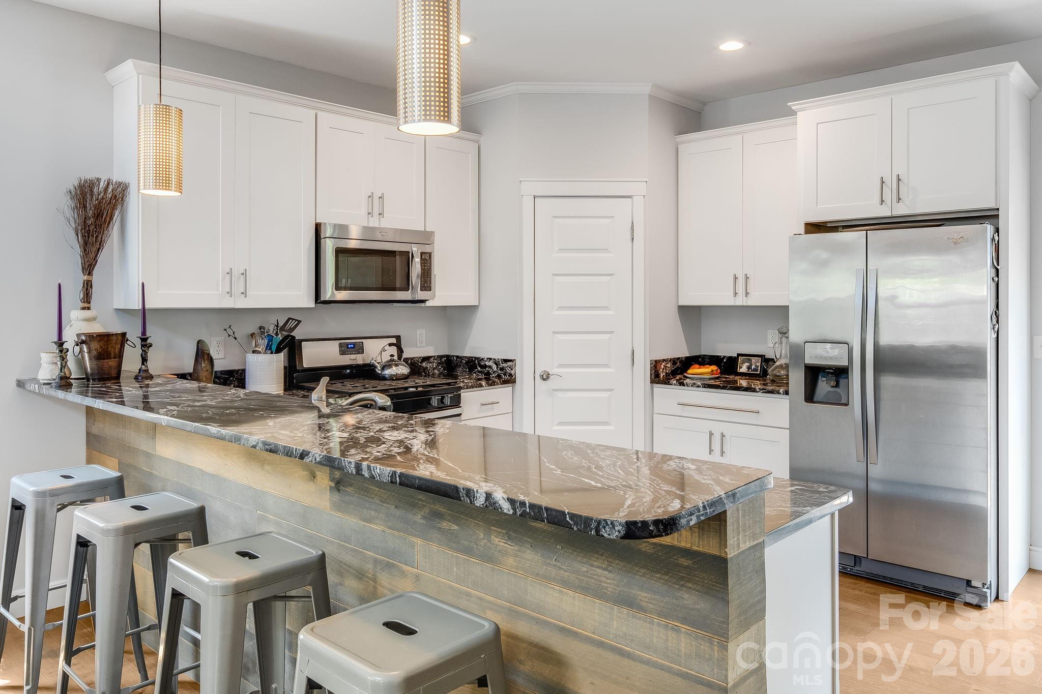 Open and well lit kitchen perfect for entertaining. - 35 Emmett Lane, Asheville