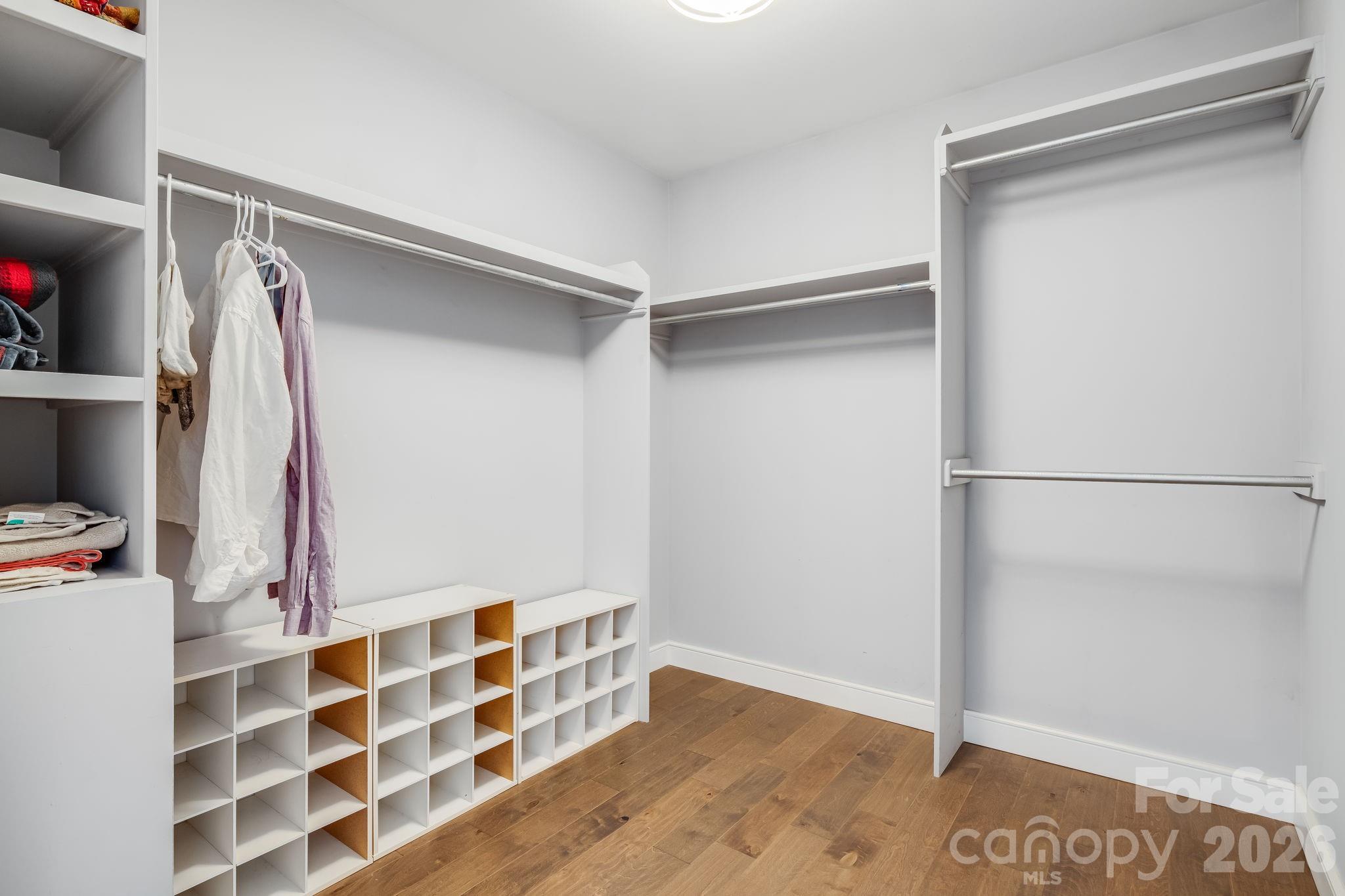 Large walk-in closet in the primary suite. - 35 Emmett Lane, Asheville