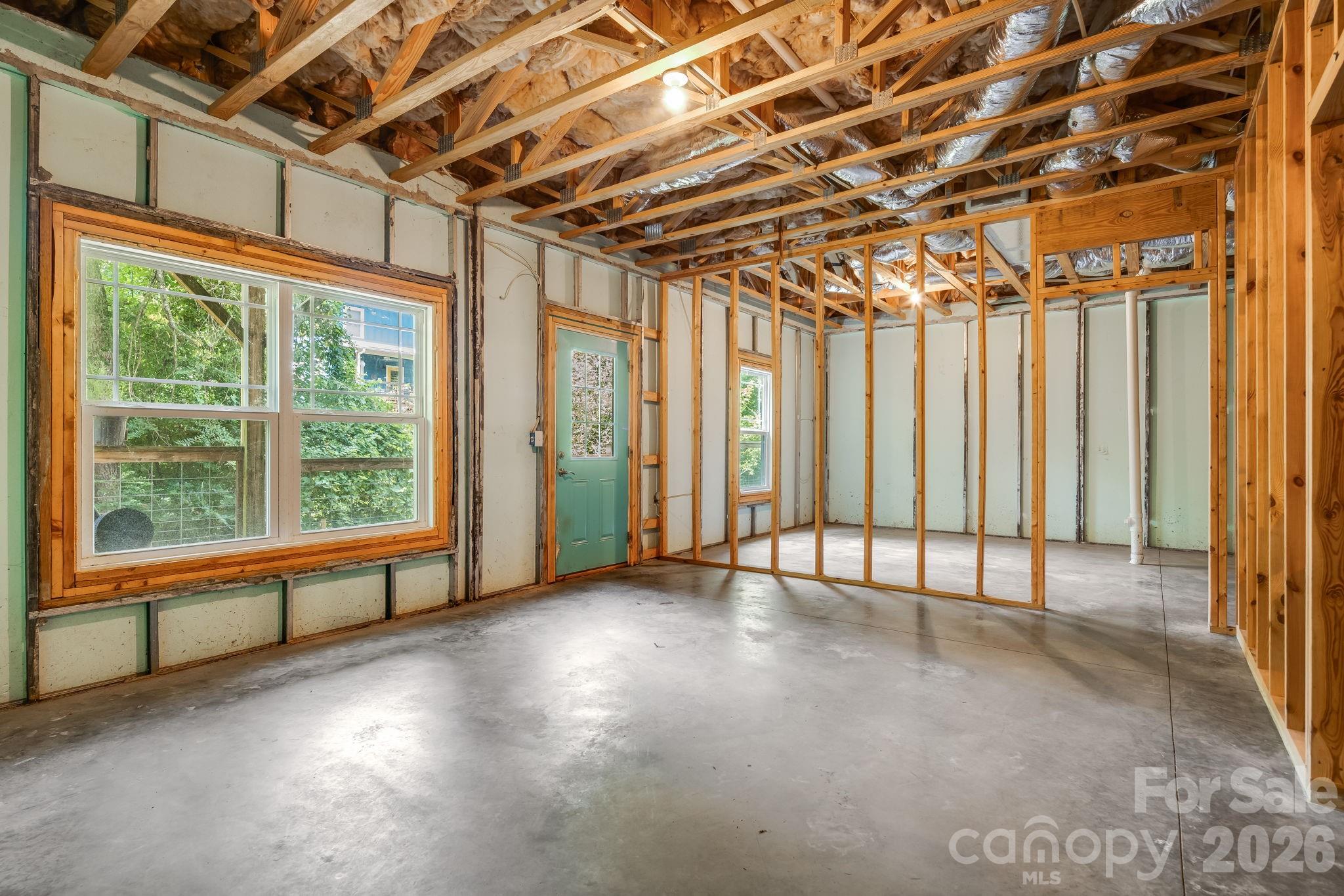 Partially finished walk-out basement. Superior walls for water tightness and easy finishing. - 35 Emmett Lane, Asheville