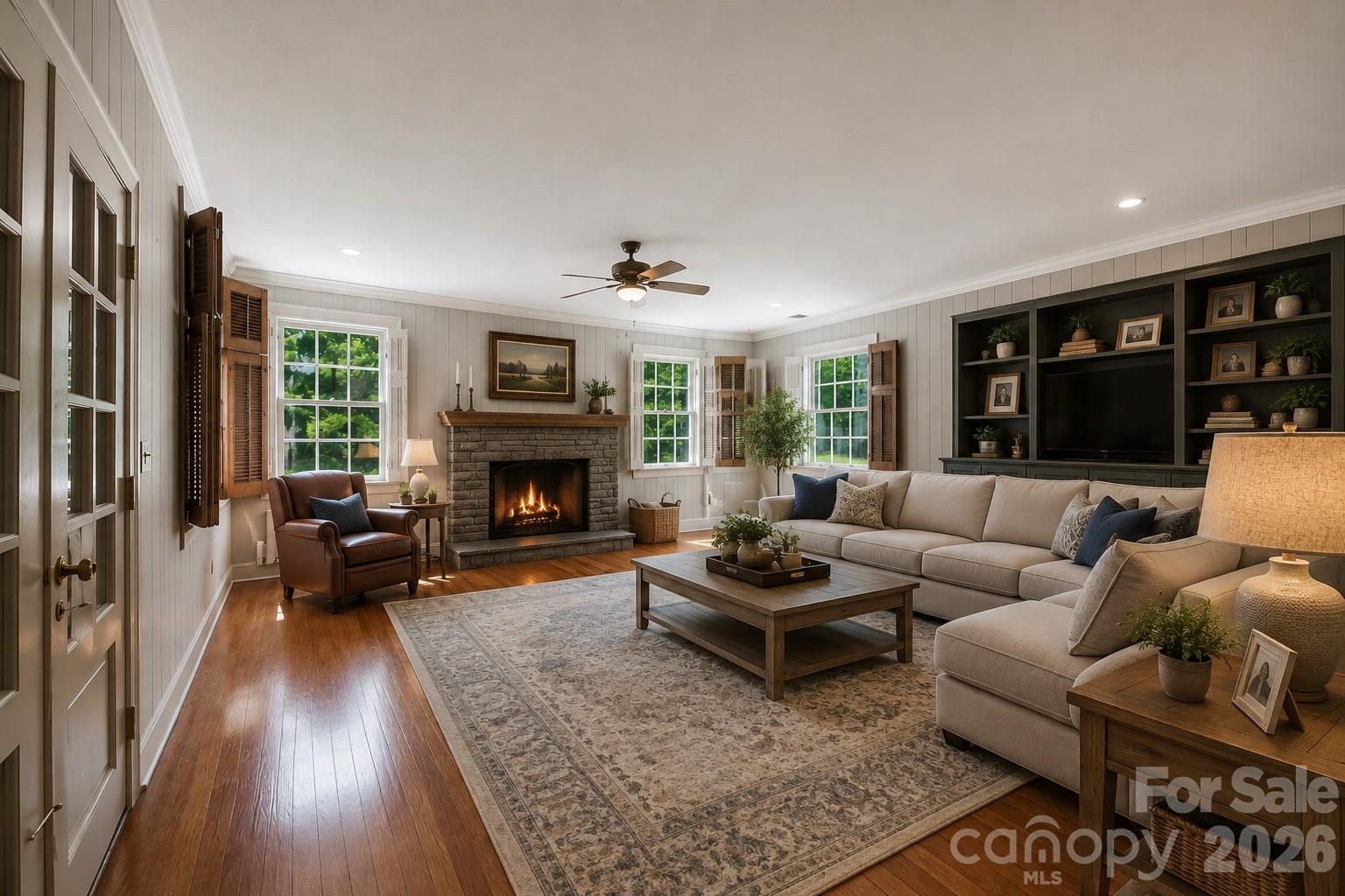 Virtually staged family room - 826 S College Avenue, Newton