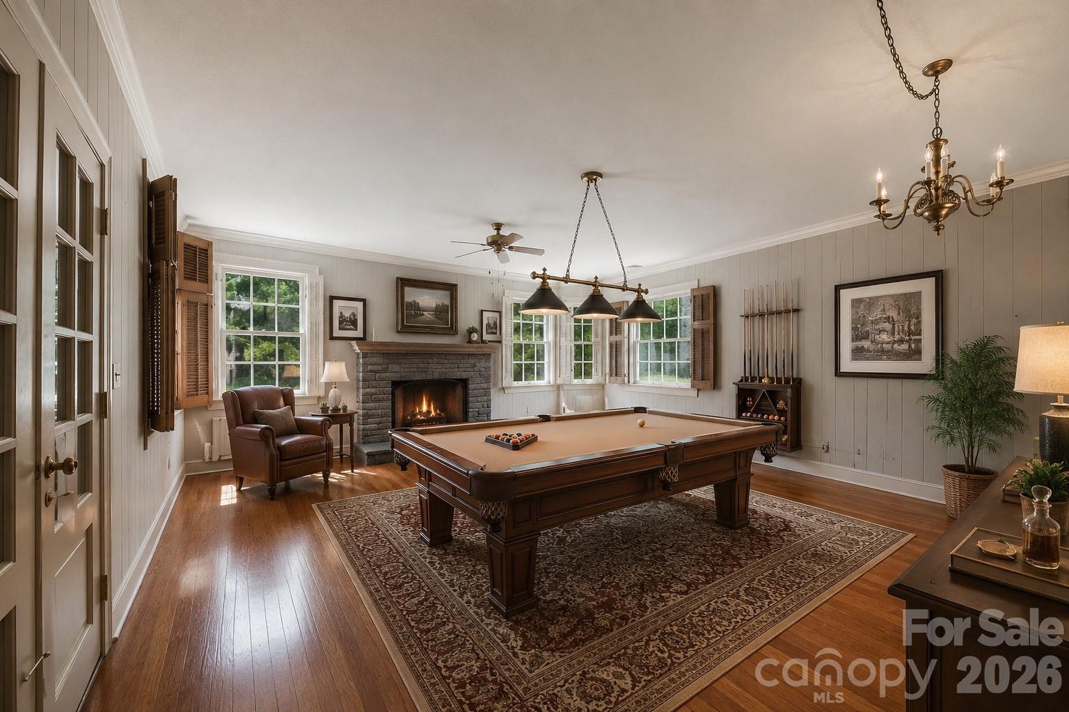 virtually staged billiard room - 826 S College Avenue, Newton