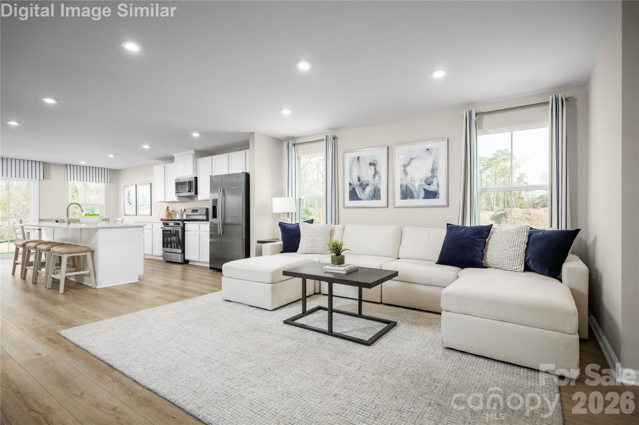 The Living Room Serves as the Heart of the Home, With an Open and Airy Layout That Invites Relaxation and Connection. - 1843 Millstream Drive, China Grove