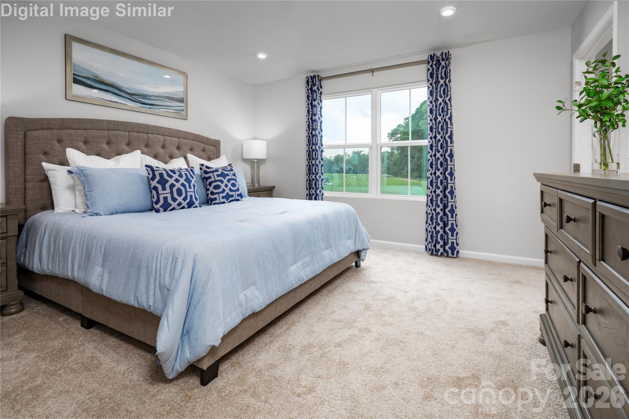 Retreat to the Serene Primary Bedroom, a Spacious Sanctuary Designed for Rest and Rejuvenation. - 1843 Millstream Drive, China Grove