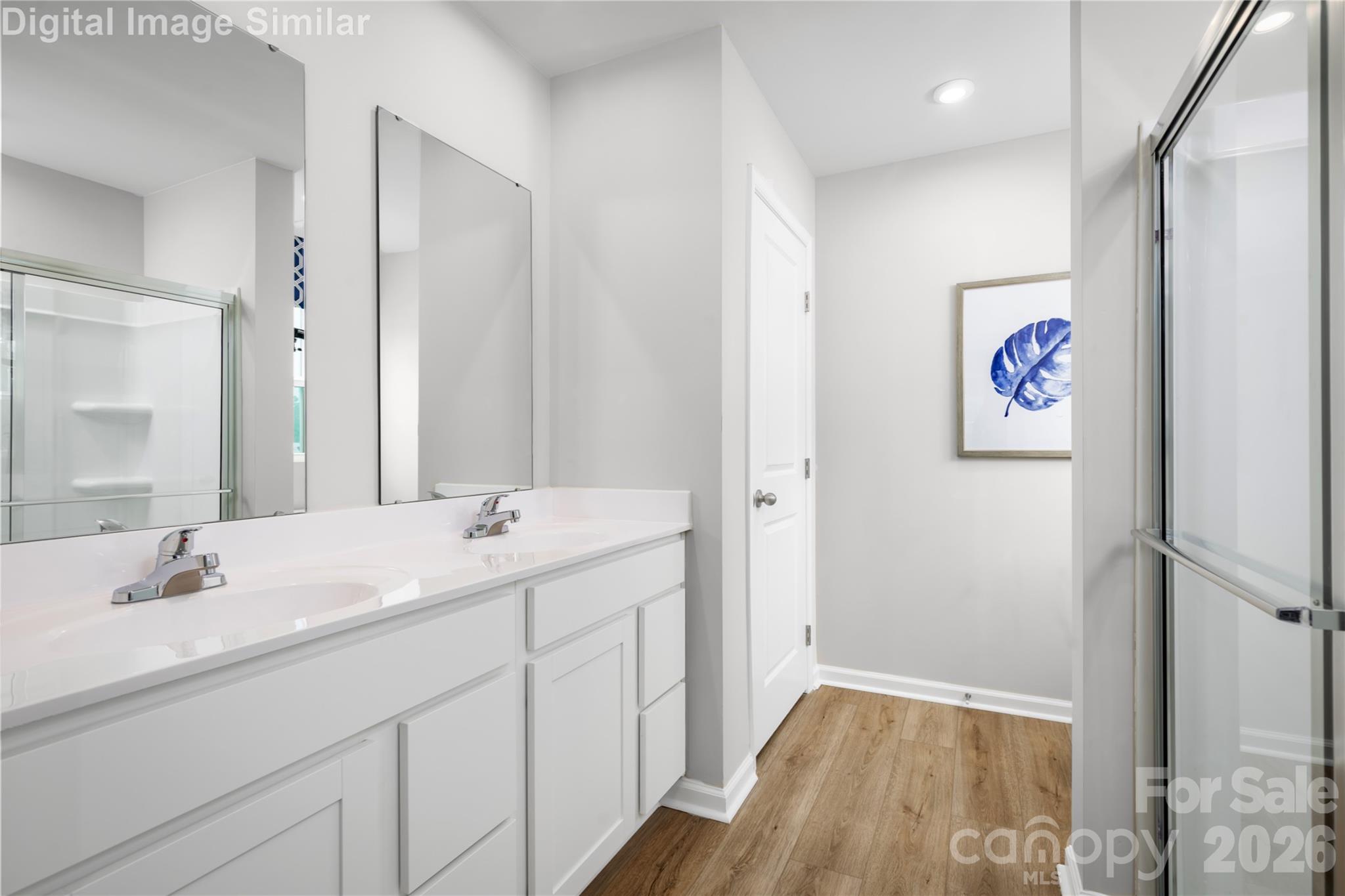 Primary Bathroom Designed With You in Mind - Spa-Inspired Shower and Dual Vanities - Every Detail Caters to Your Daily Routine and Quiet Moments of Indulgency. - 1843 Millstream Drive, China Grove
