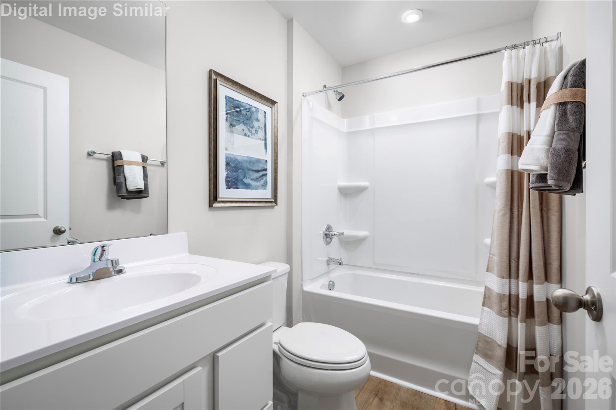 The Shared Guest Bathroom has Bright Finishes and Easy-to-Clean Surfaces. Built to Handle Morning Routines and Splashy Bath Times Alike. - 1843 Millstream Drive, China Grove