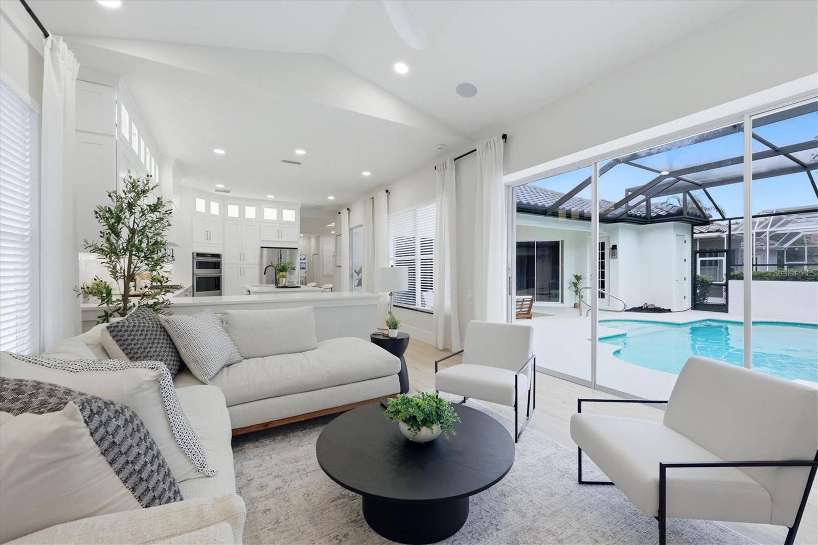 Family Room with View of Lanai and Pool - 7825 WILTON CRESCENT CIR, BRADENTON