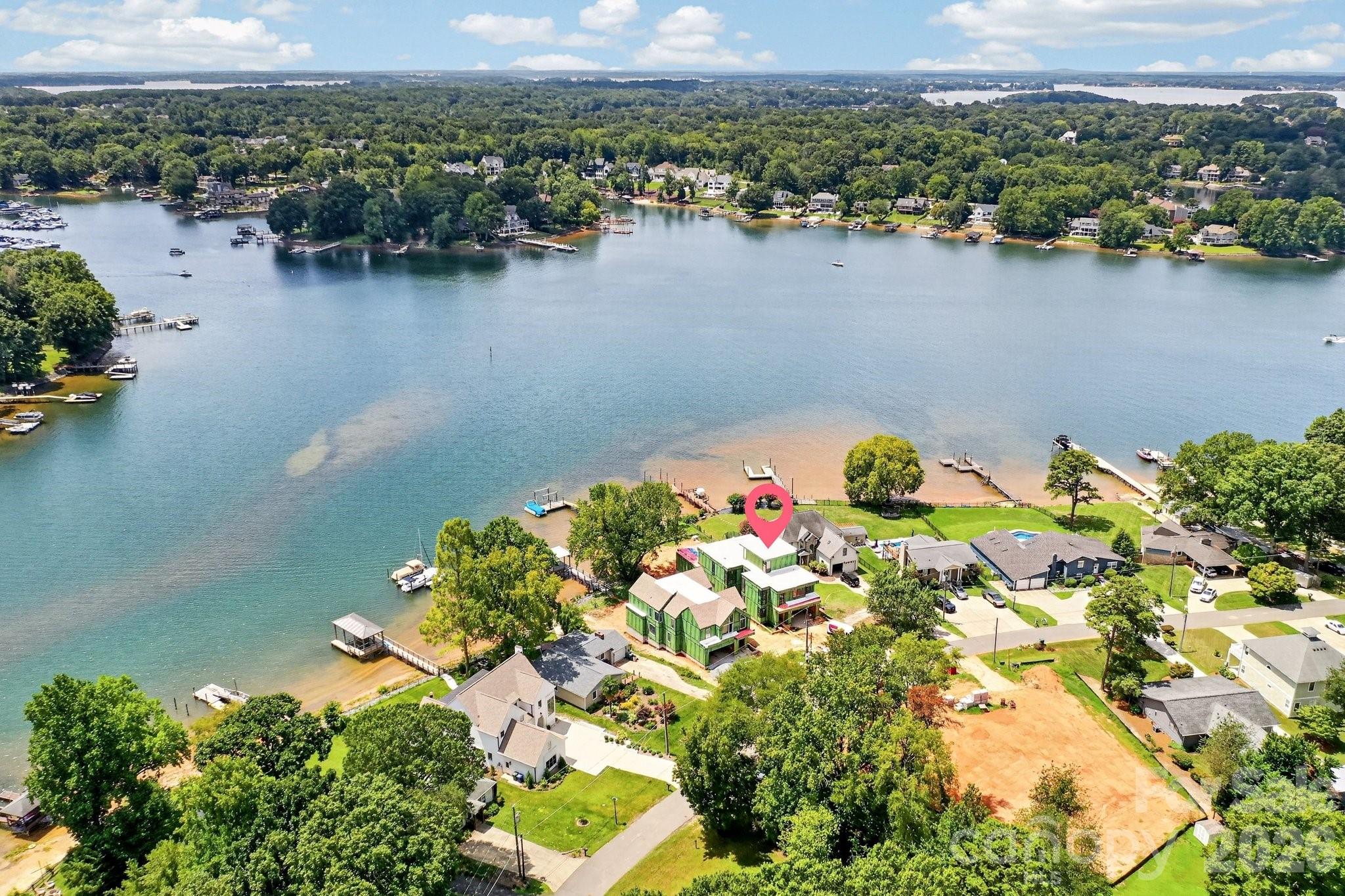 Another aerial view of the homes positioning on the lake. At the end of the pier is plenty of water for your boat. - 21506 Rio Oro Drive, Cornelius