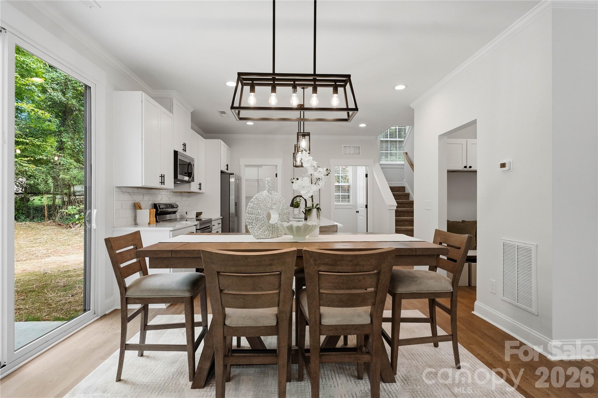 Sliding door off kitchen and dining area leads to rear patio - 14133 Woodhurst Lane, Mint Hill