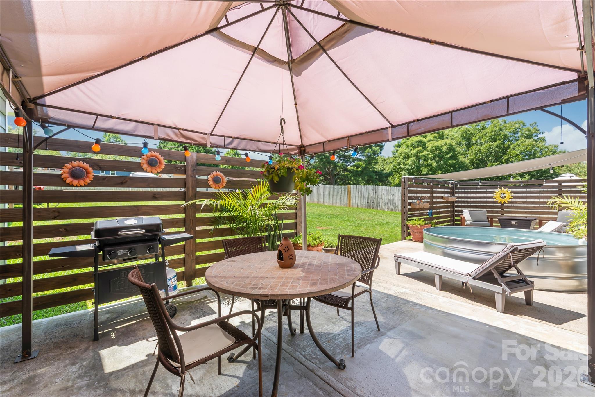 Back patio off of kitchen with canopy. Perfect for grilling and dinner outdoors - 2241 Indian Cross Trail, Matthews