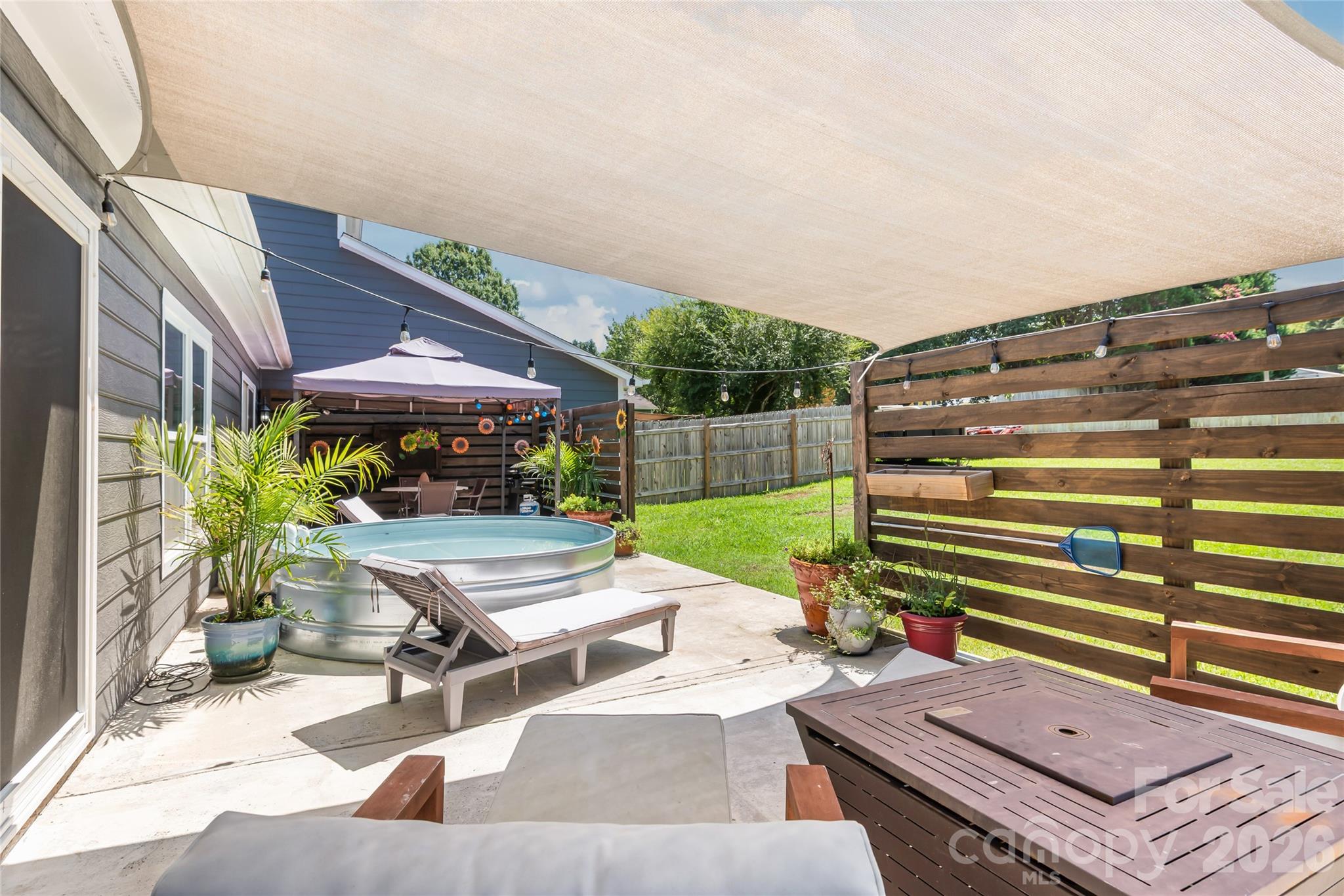 Sunsail covered patio area off of Main home Primary bedroom - 2241 Indian Cross Trail, Matthews