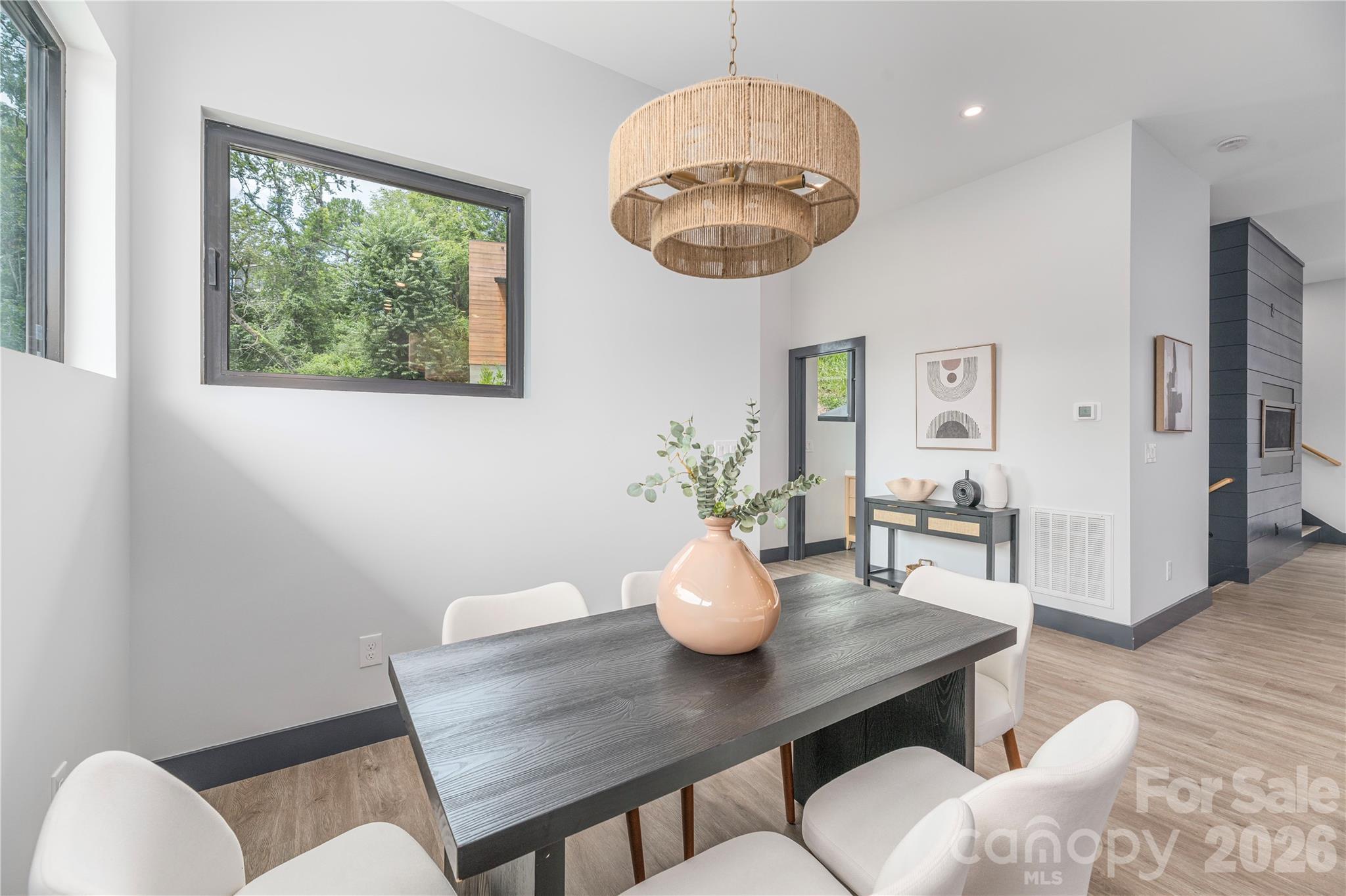 Dining area open to the living area - 19 Woodbine Road, Asheville