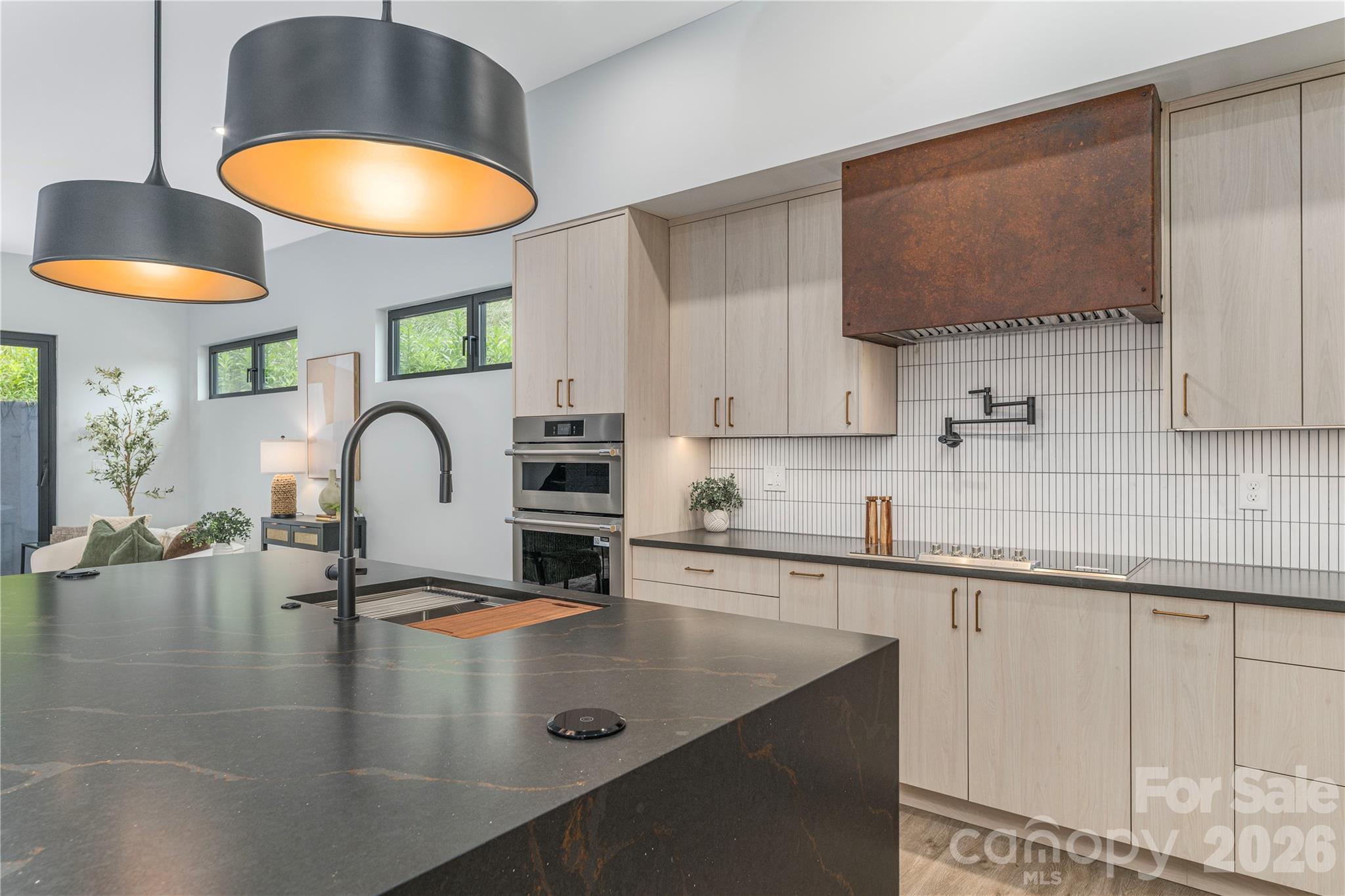 The lighting adds warmth to this standout kitchen - 19 Woodbine Road, Asheville