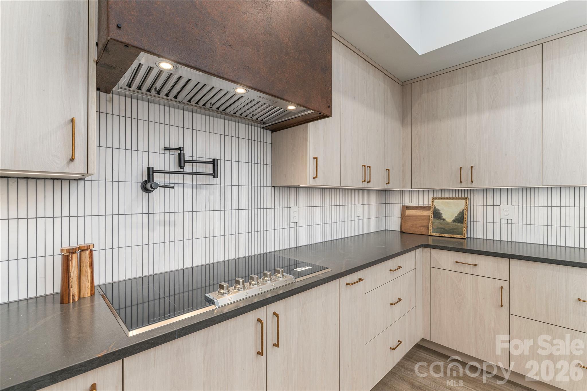 Induction cooktop and hand-hewn copper hood. - 19 Woodbine Road, Asheville