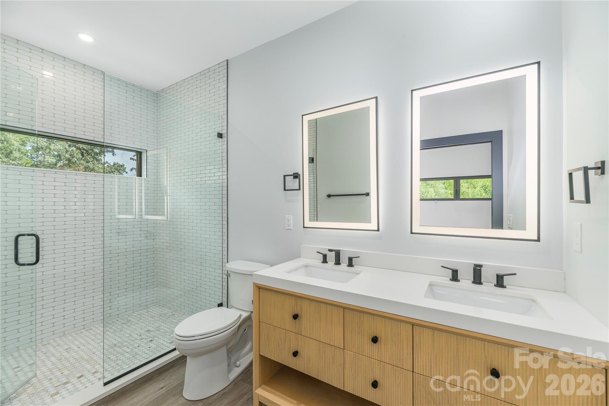 Bedroom two ensuite with double sink vanity and tiled shower - 19 Woodbine Road, Asheville