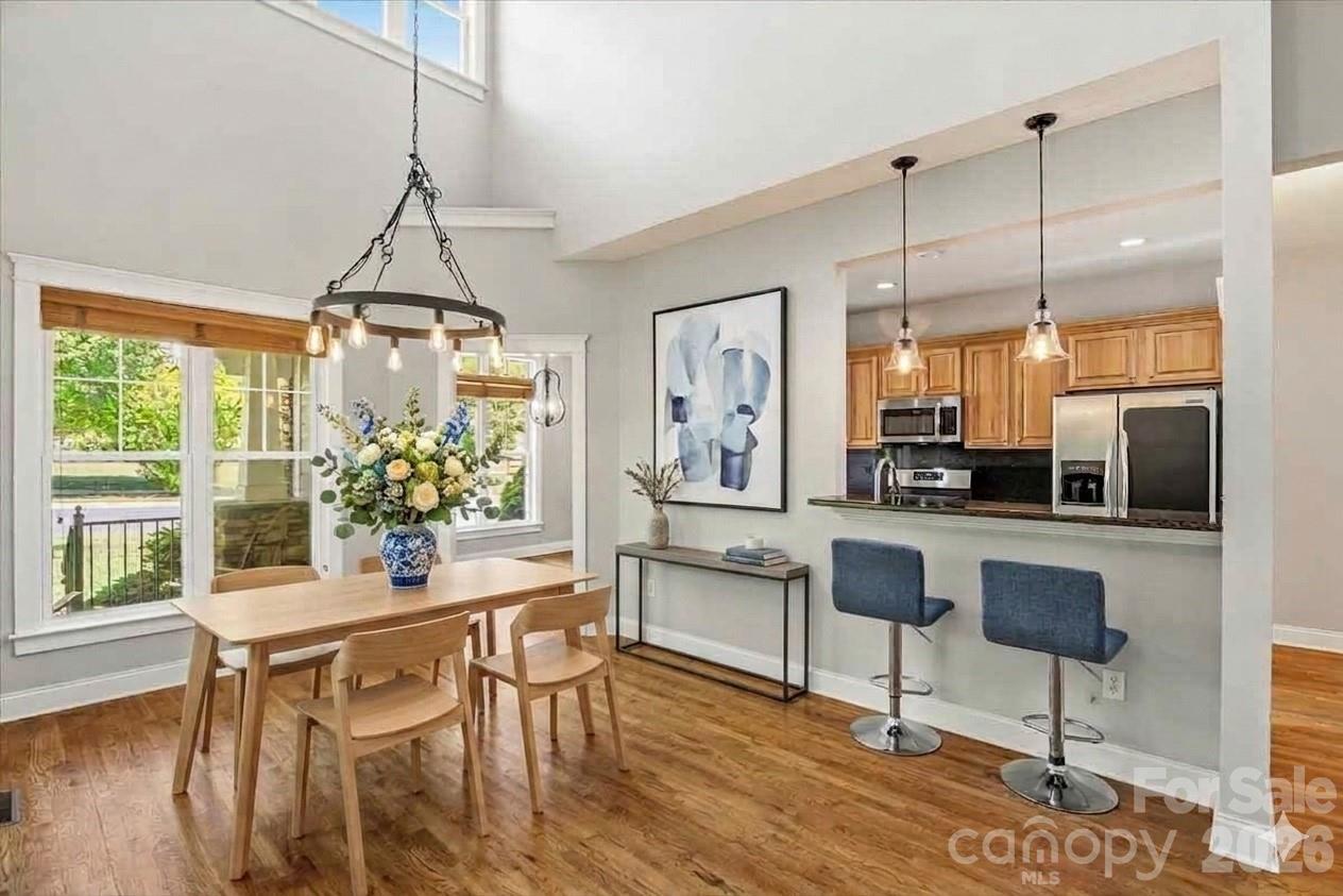 Breakfast area and kitchen bar area - Virtually staged - 126 Carolina Bluebird Loop, Arden