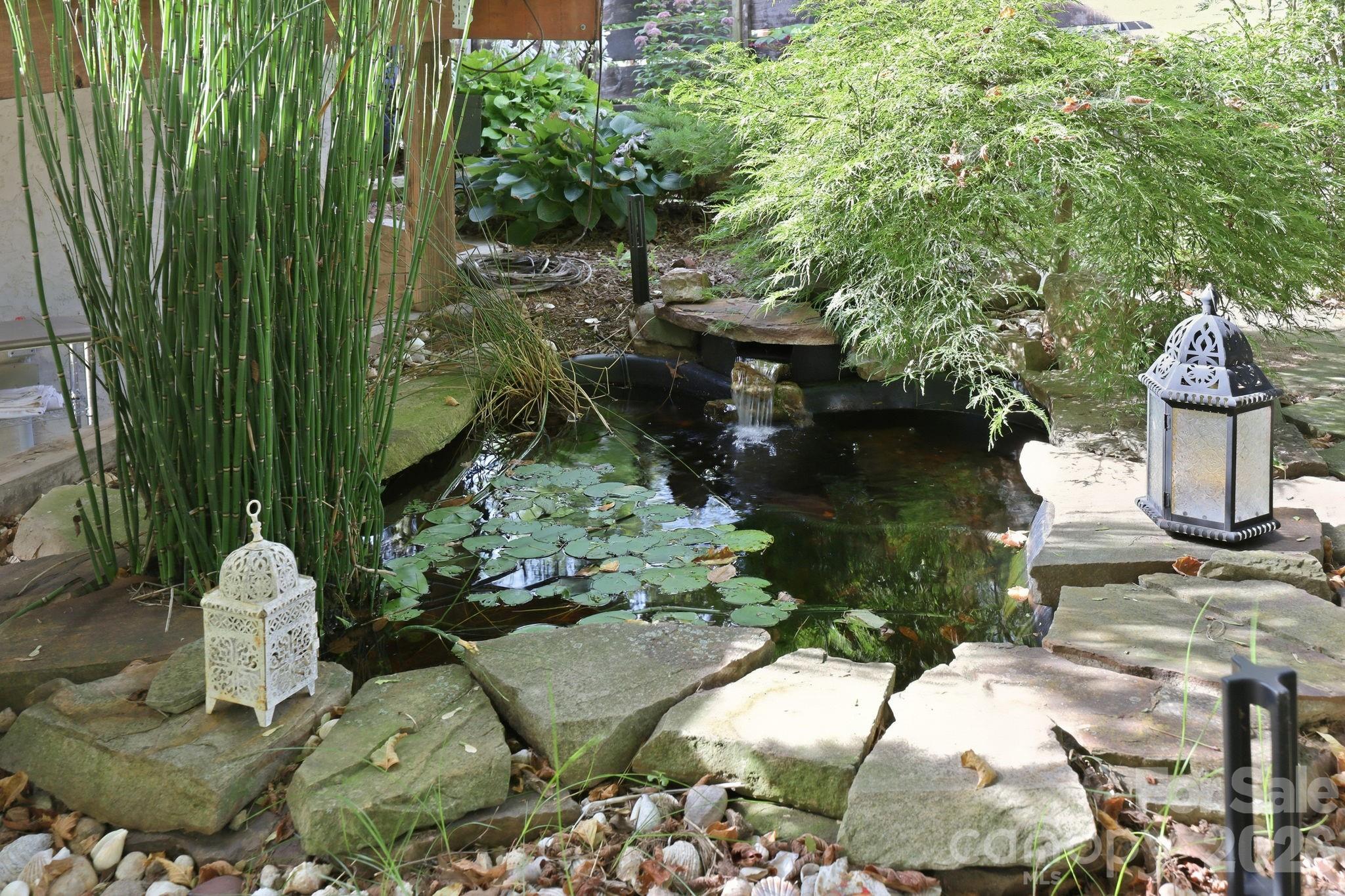 Serene water feature nestled along the garden path. - 146 Courtland Avenue, Asheville