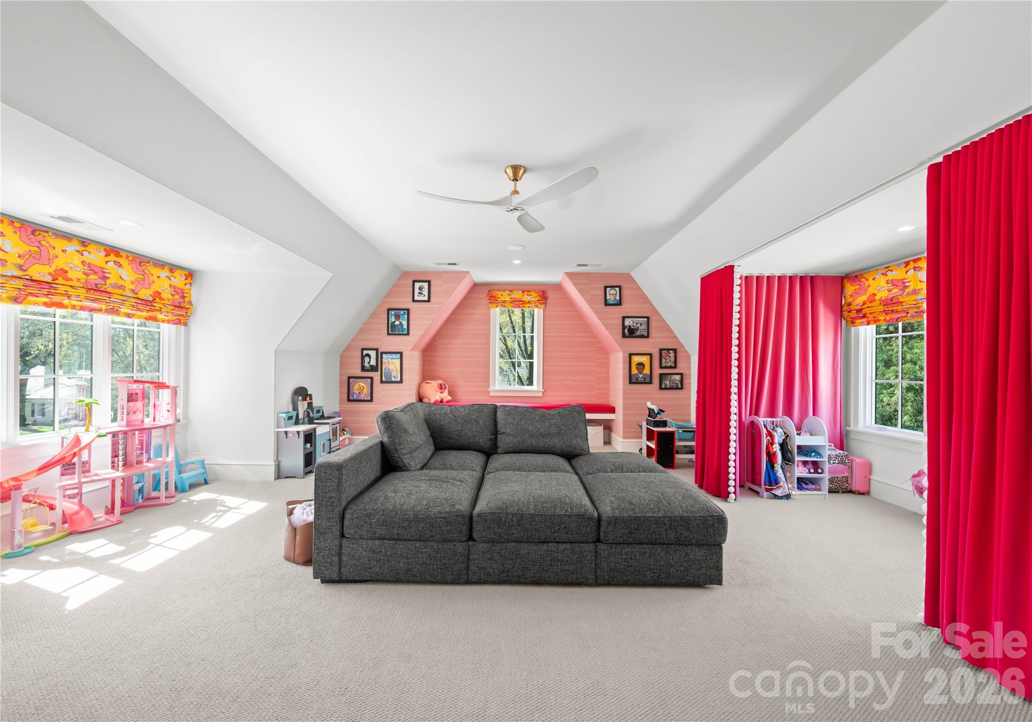 Bonus room with motorized shades, reading bench with custom velvet cushion, and adorable "theater" curtains. - 2610 Sedley Road, Charlotte