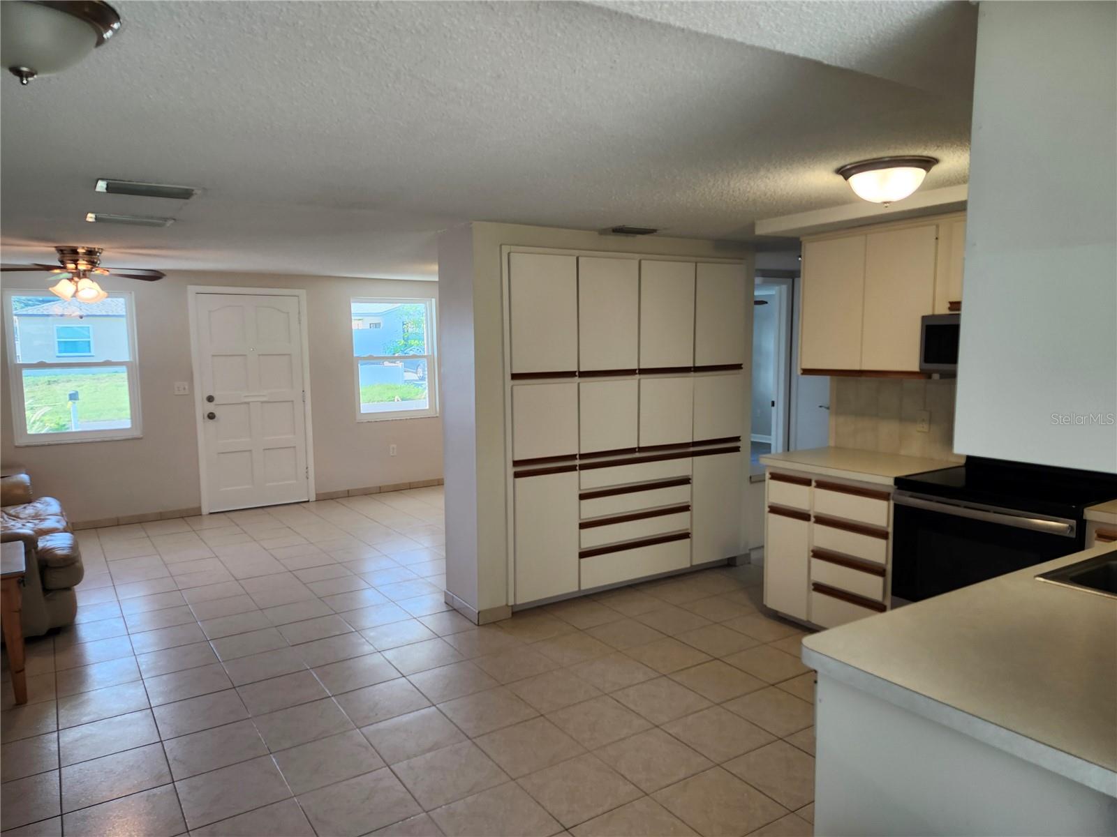Kitchen Storage looking into living room - 6144 SAPPHIRE DR, NEW PORT RICHEY