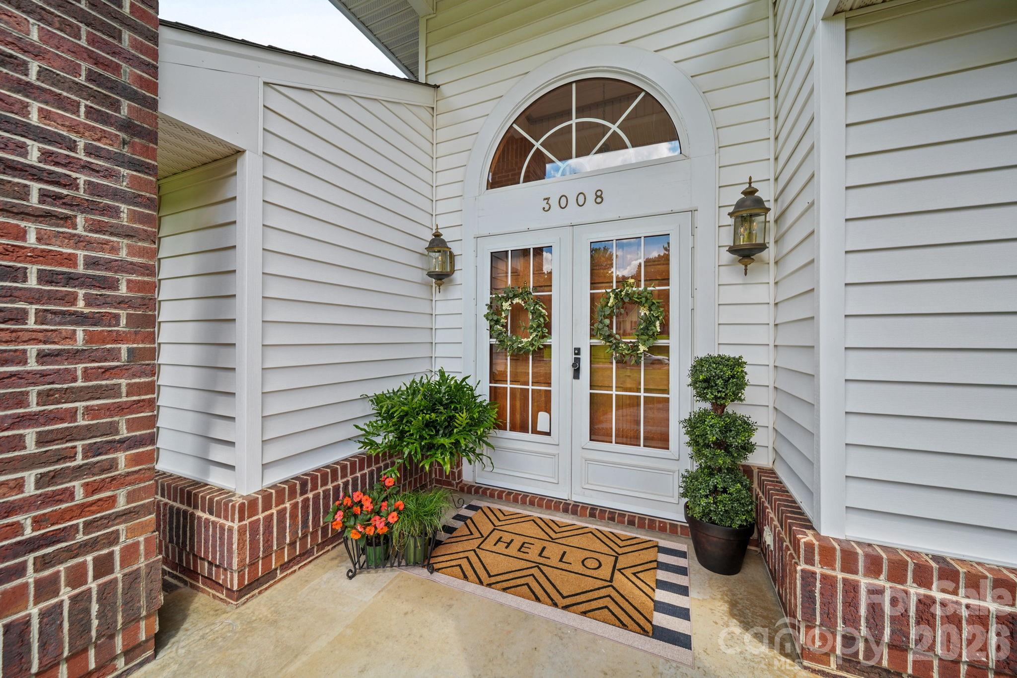 A custom brick band wraps the exterior of the home. - 3008 Eaker Drive, Cherryville